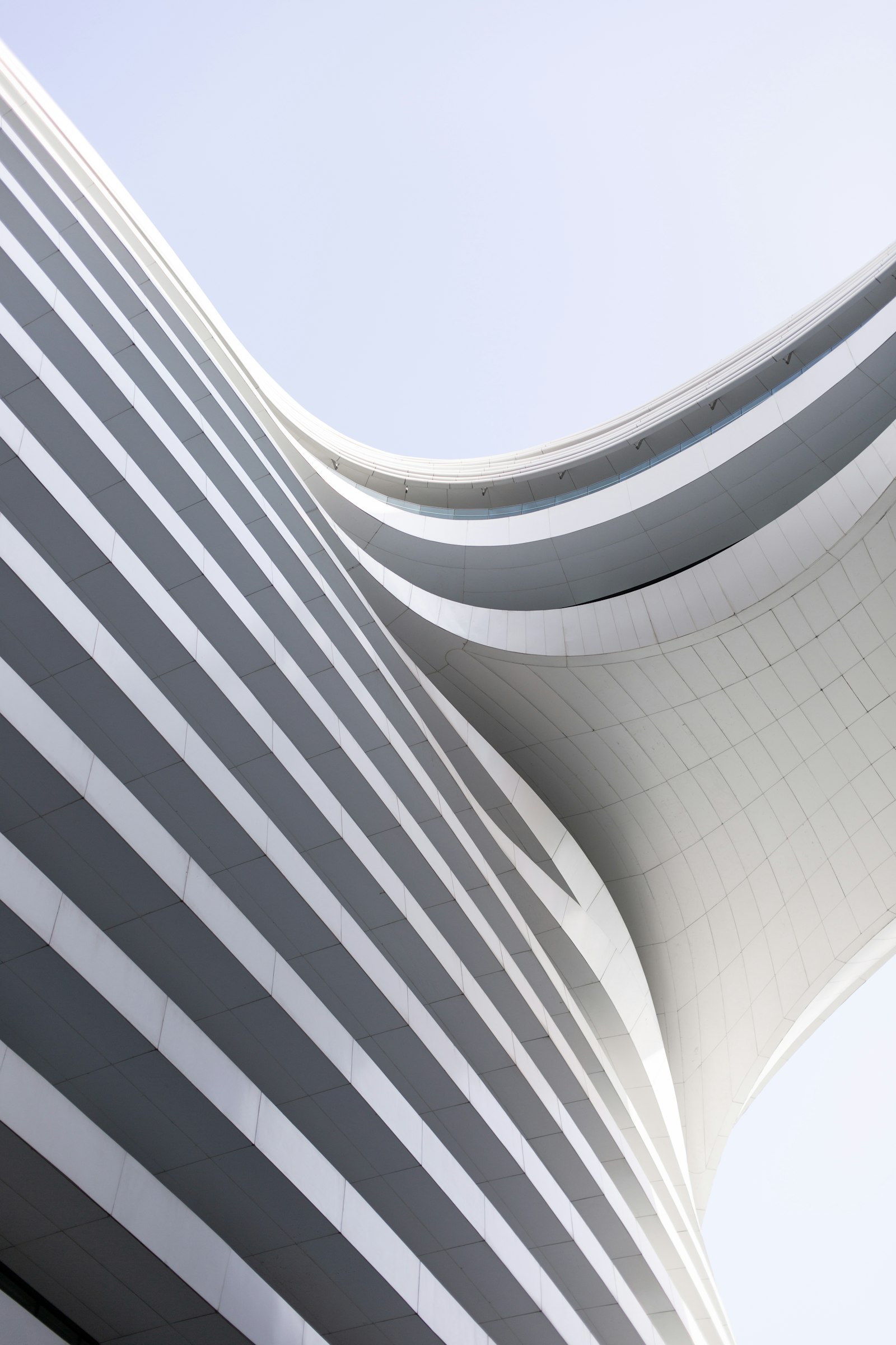 Curved modern architecture against the sky