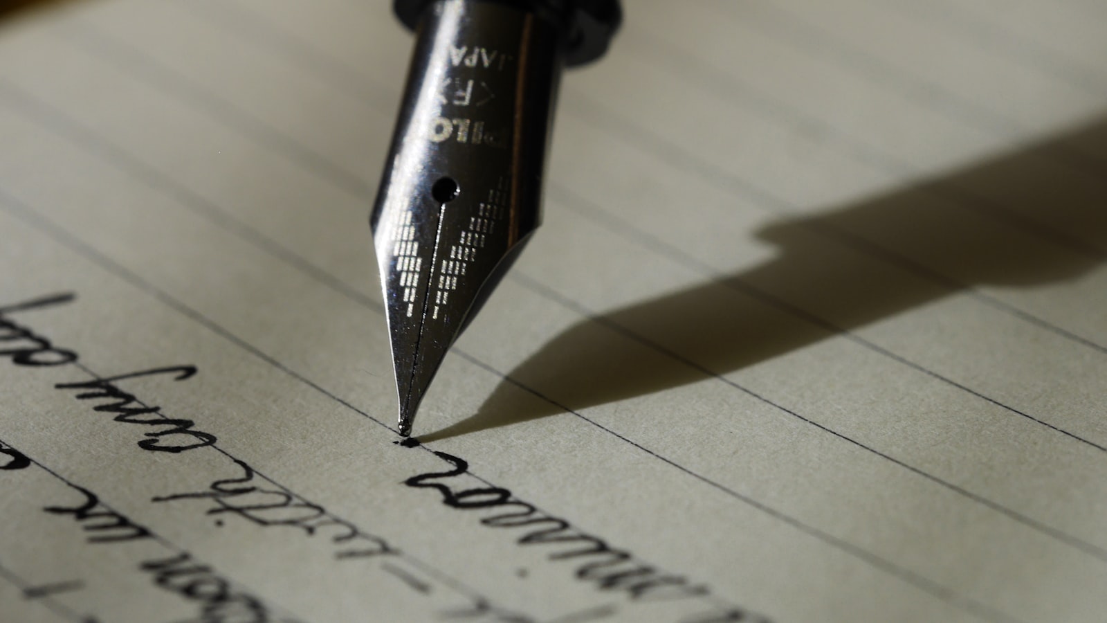 Fountain pen resting on paper, ready to sign