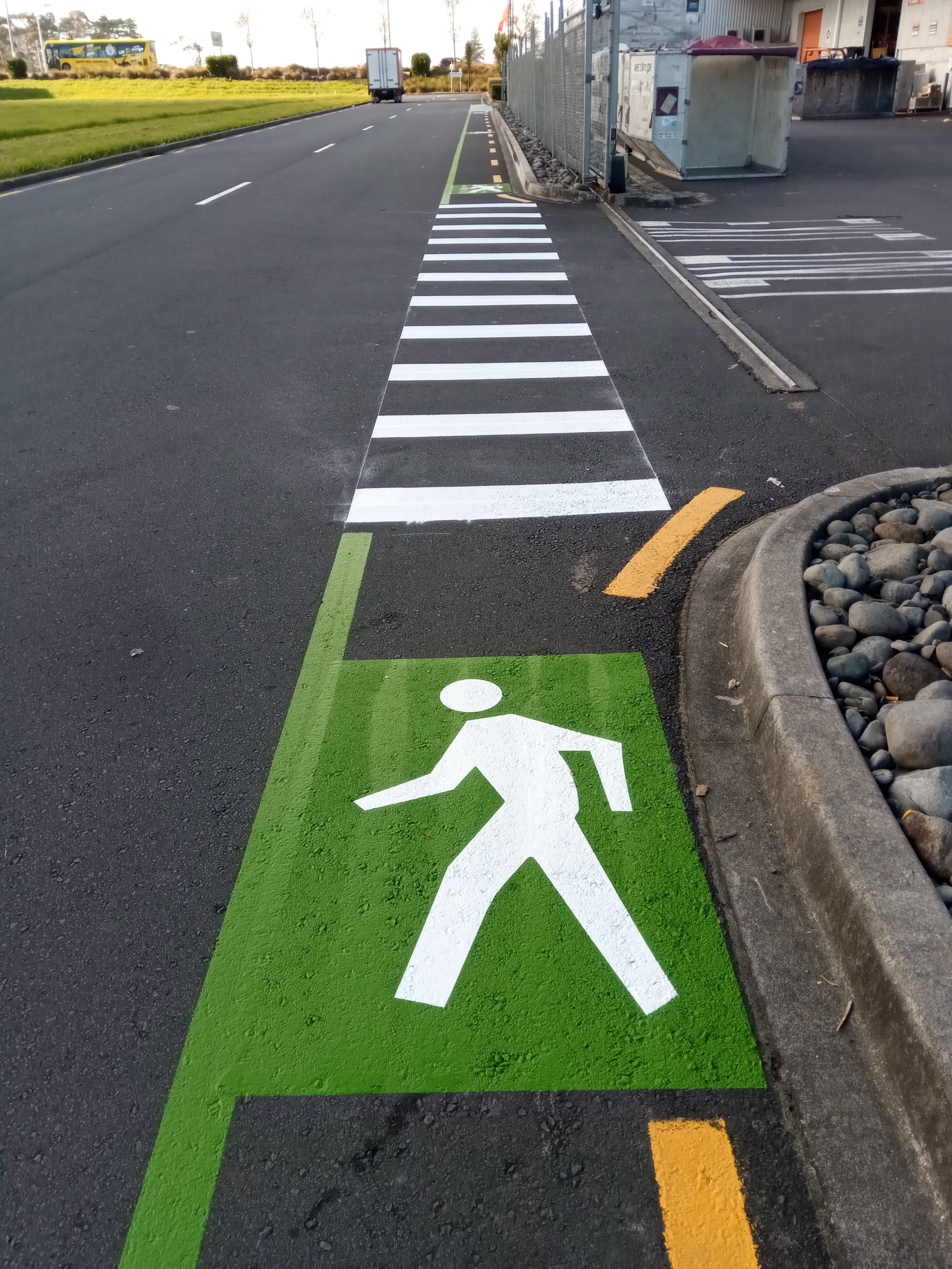 Carpark Marking design and mark high-visibility pedestrian routes to protect people in warehouses, schools and public spaces in Auckland, Waikato and Bay of Plenty New Zealand.