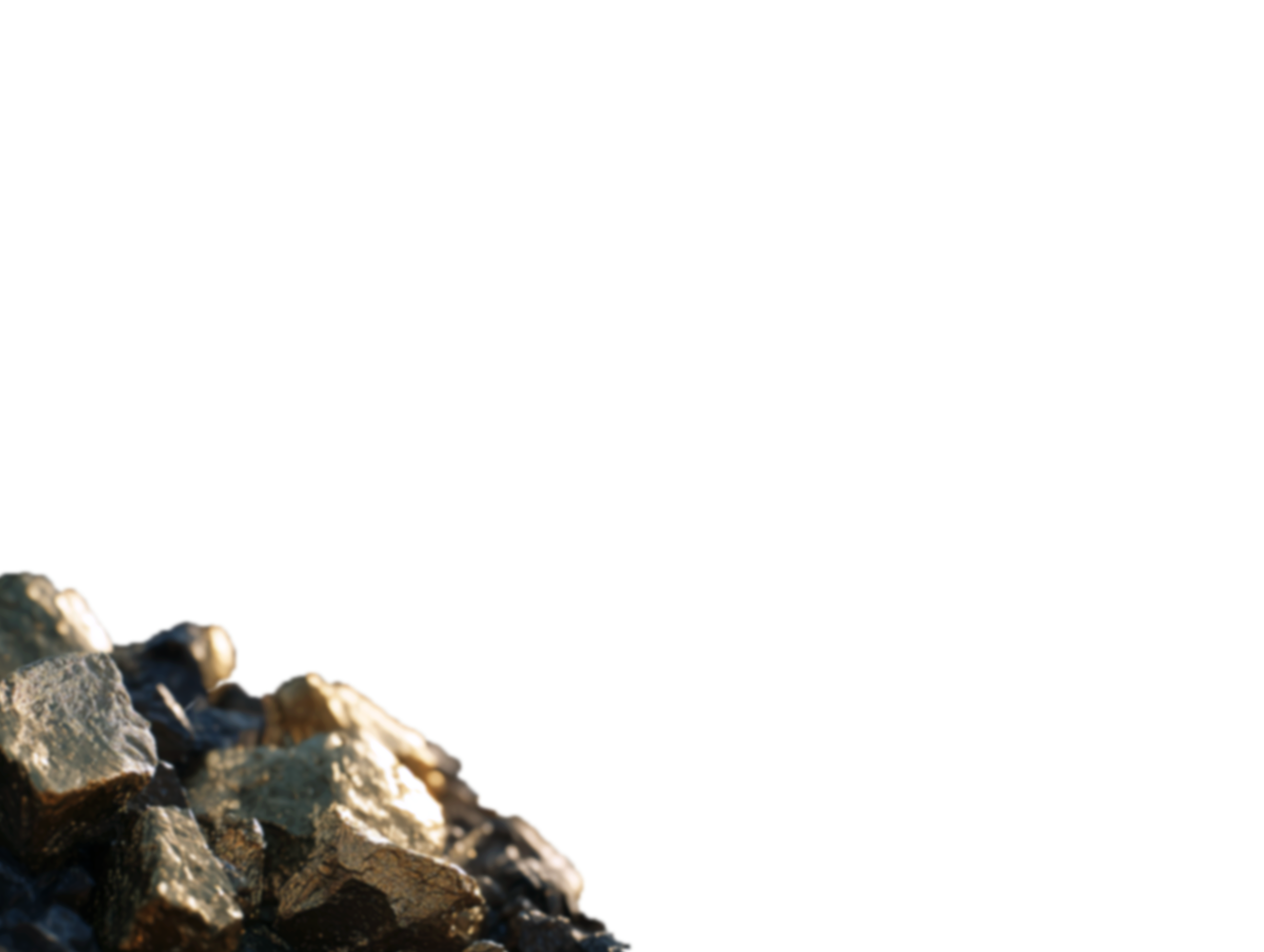 Close-up of shiny gold-colored metallic rocks with a blurred dark background.