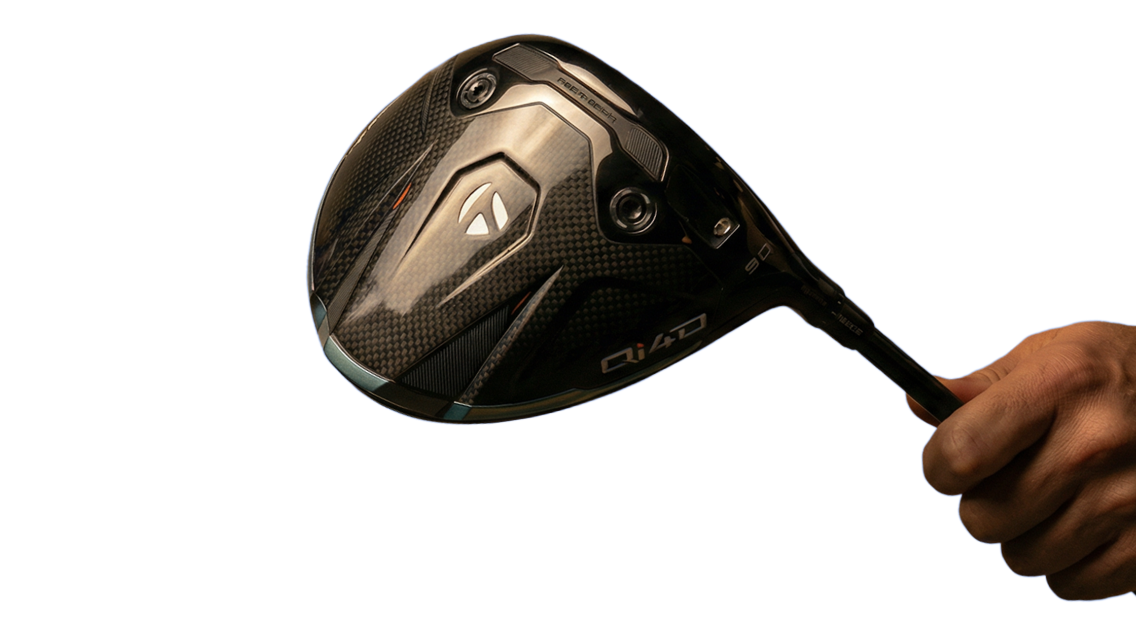 Close-up of a hand holding a TaylorMade carbon fiber golf driver club head.