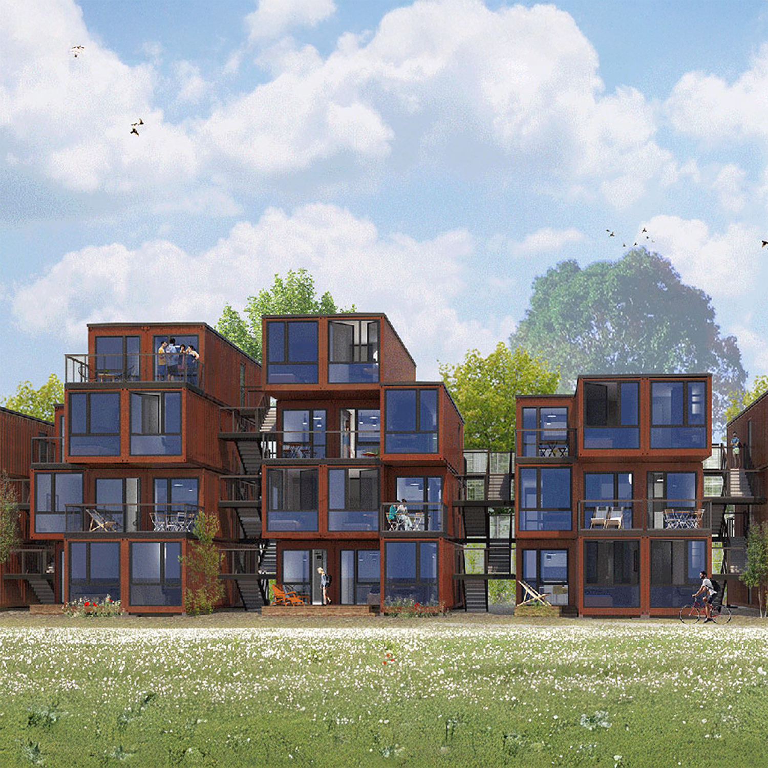 Mehrstöckige Wohnhäuser aus gestapelten roten Container-Modulen mit verglasten Fenstern und Balkonen in einer grünen Wiese.