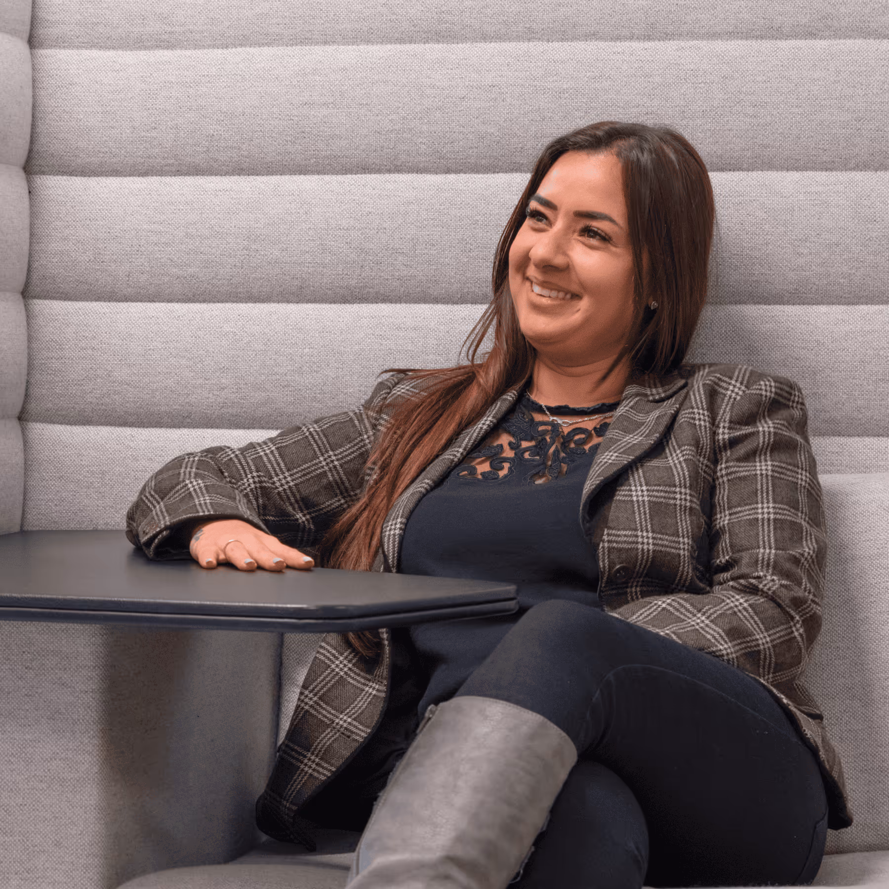 a woman sitting in a booth