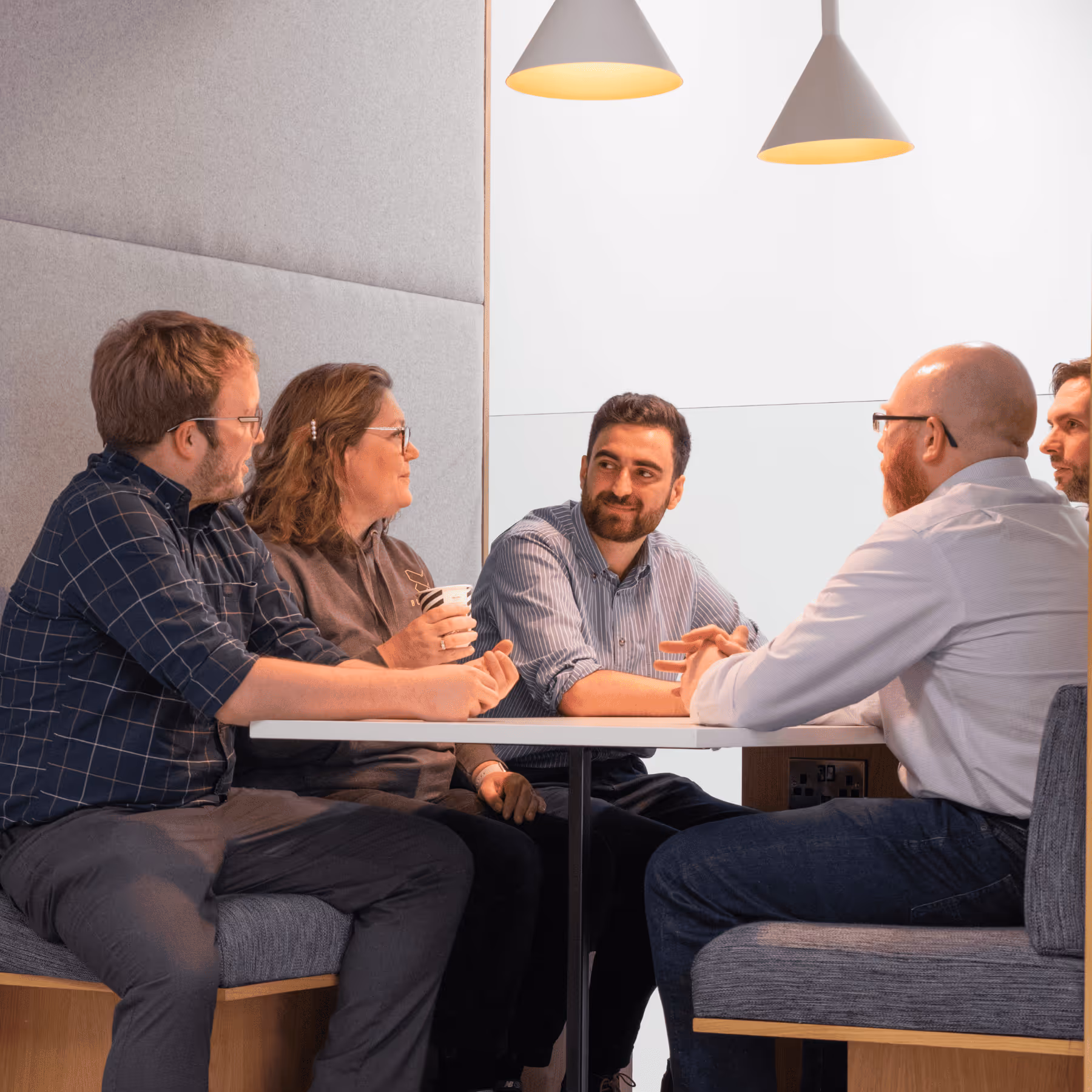 a group of people sitting at a table