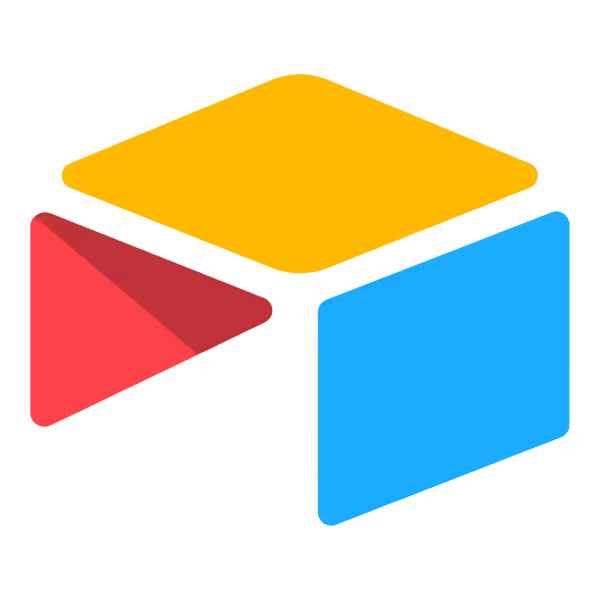 Colorful abstract cube with yellow top, red left, and blue right faces.