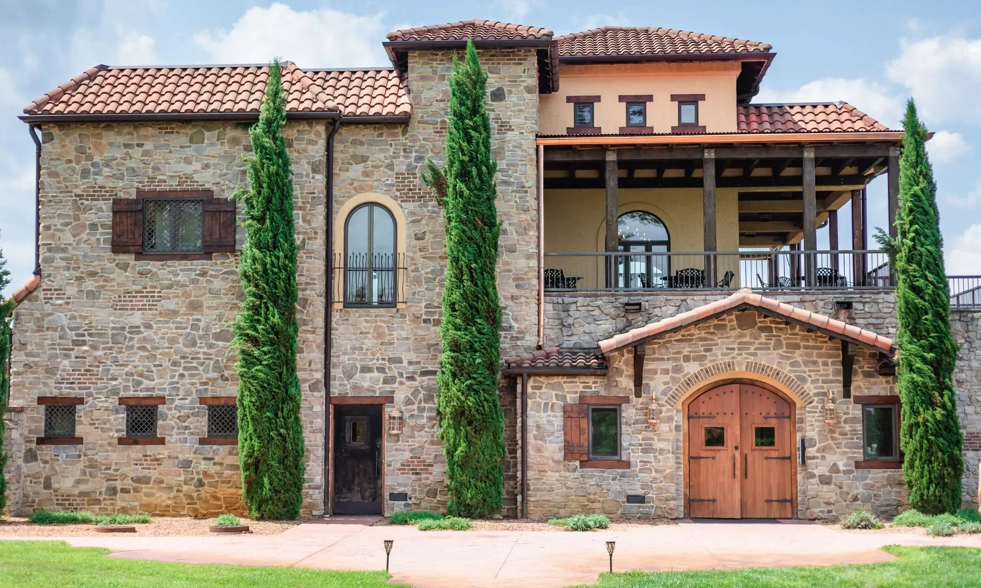 Stone villa and main estate building at Raffaldini Vineyards with green manicured lawns.