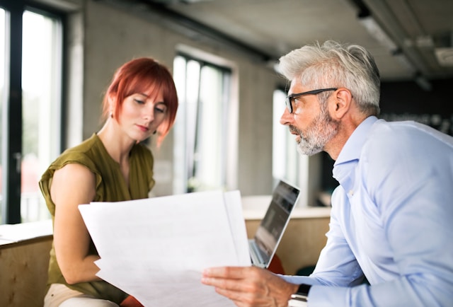 Man advising a client on a way to succeed 