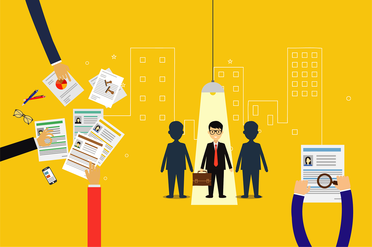 A person standing out from the crowd under a spotlight.