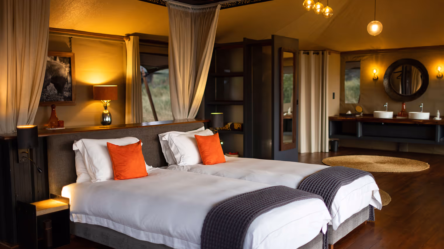 Luxurious safari-themed bedroom with cozy canopy bed and warm natural lighting features.