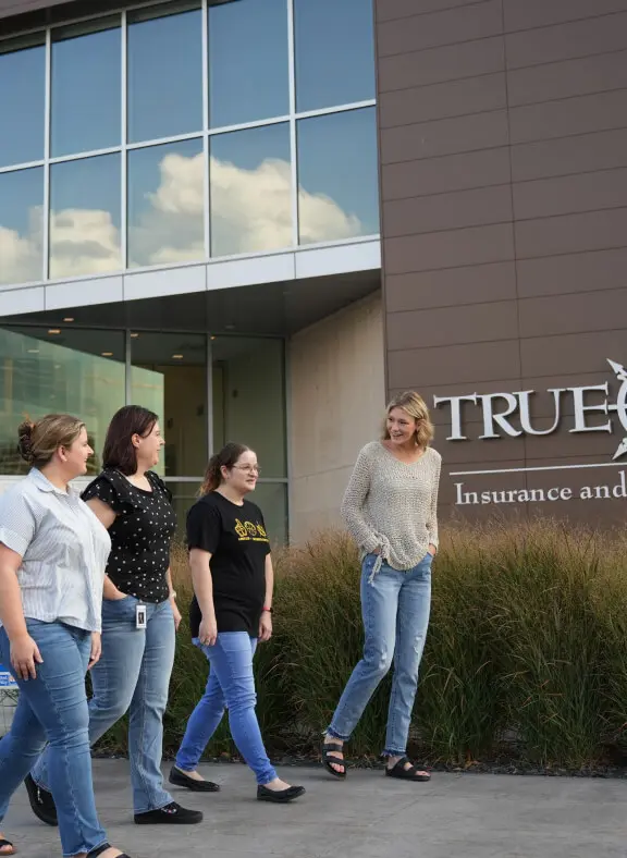 People walking in front of the TrueNorh HQ