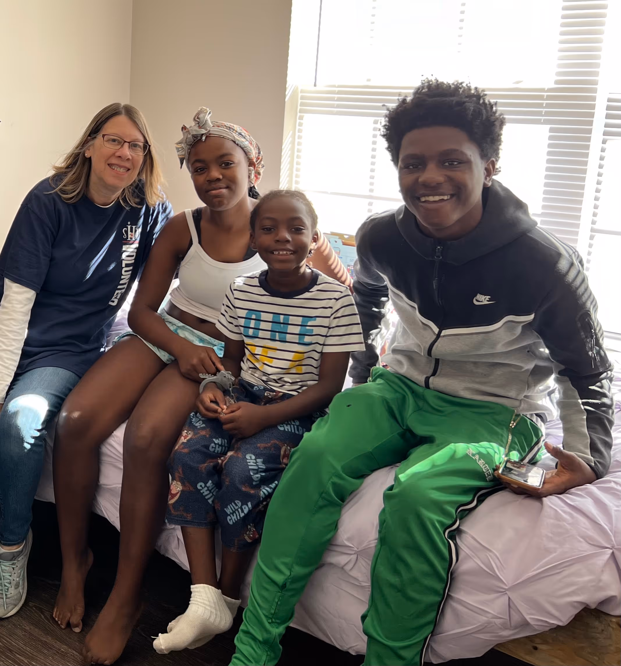 Teri Krumm with children who benefited from her nonprofit work. 