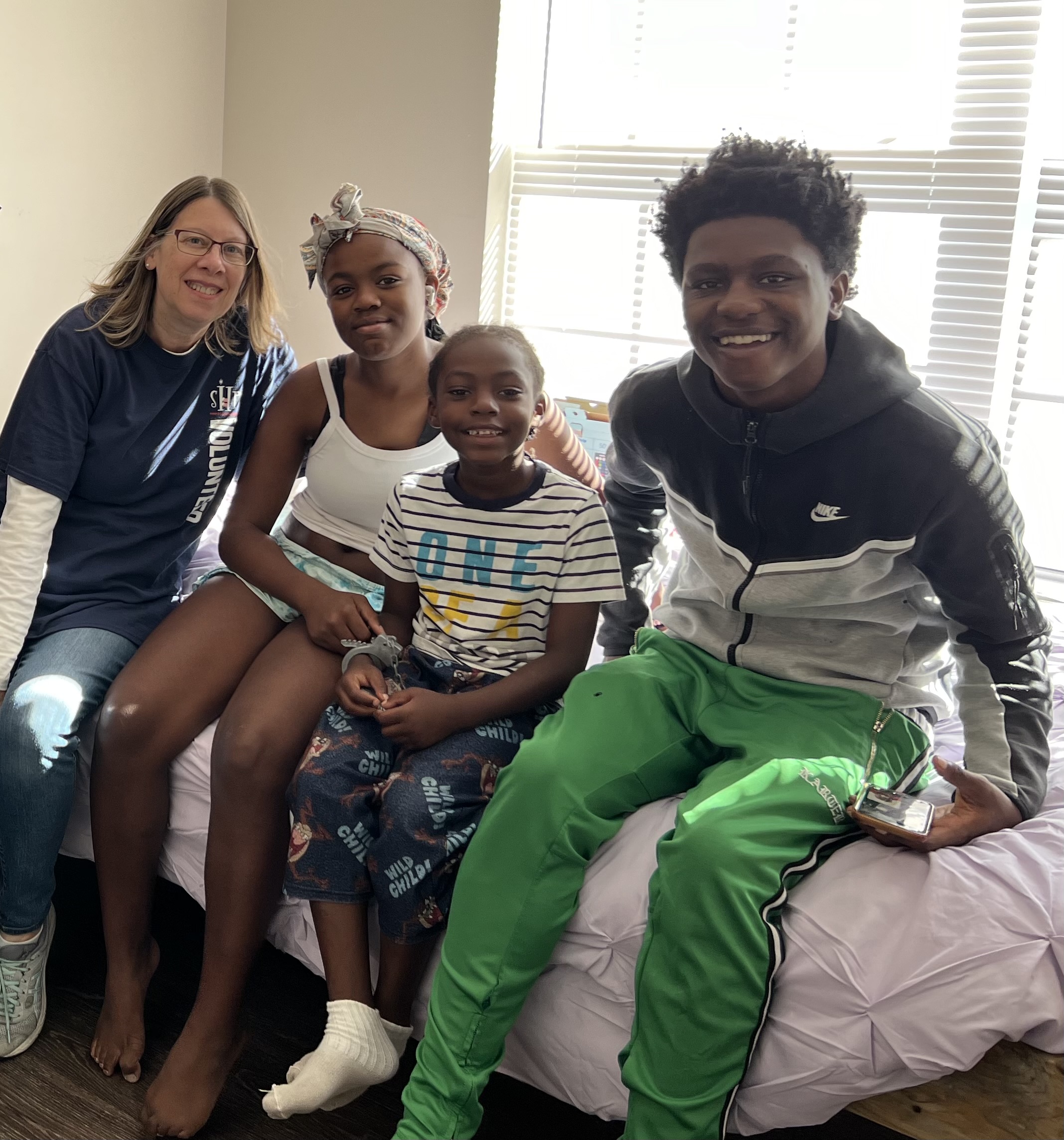 Teri Krumm with children who benefited from her nonprofit work. 