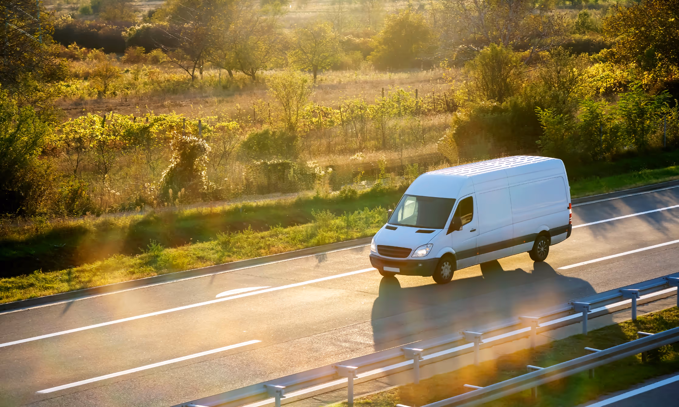 White van driving on the road