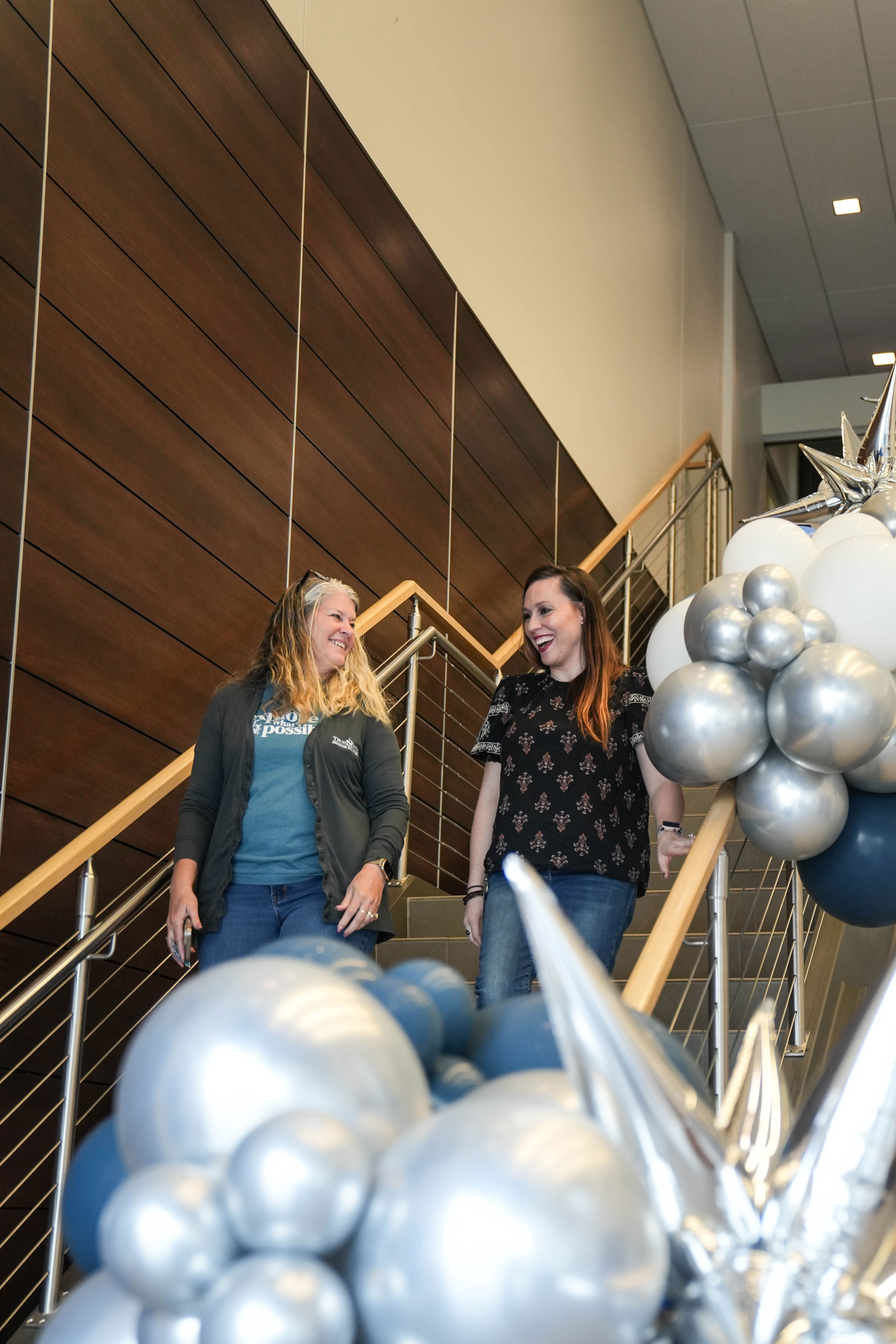 TrueNorth colleagues walking down the stairs. 