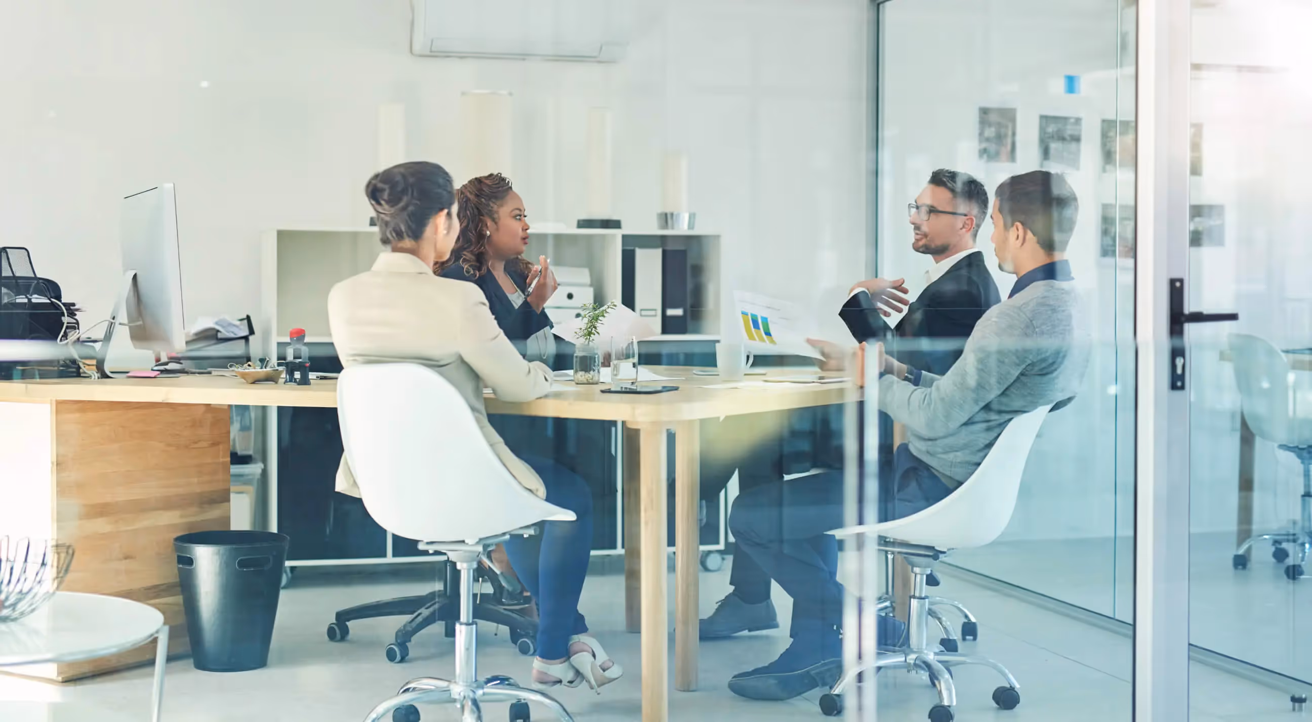 Photo of people in an office during a meeting