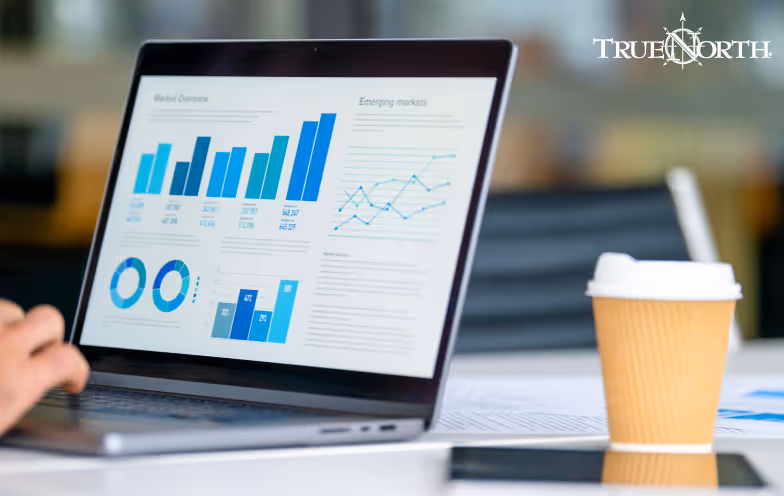 laptop screen with graphs