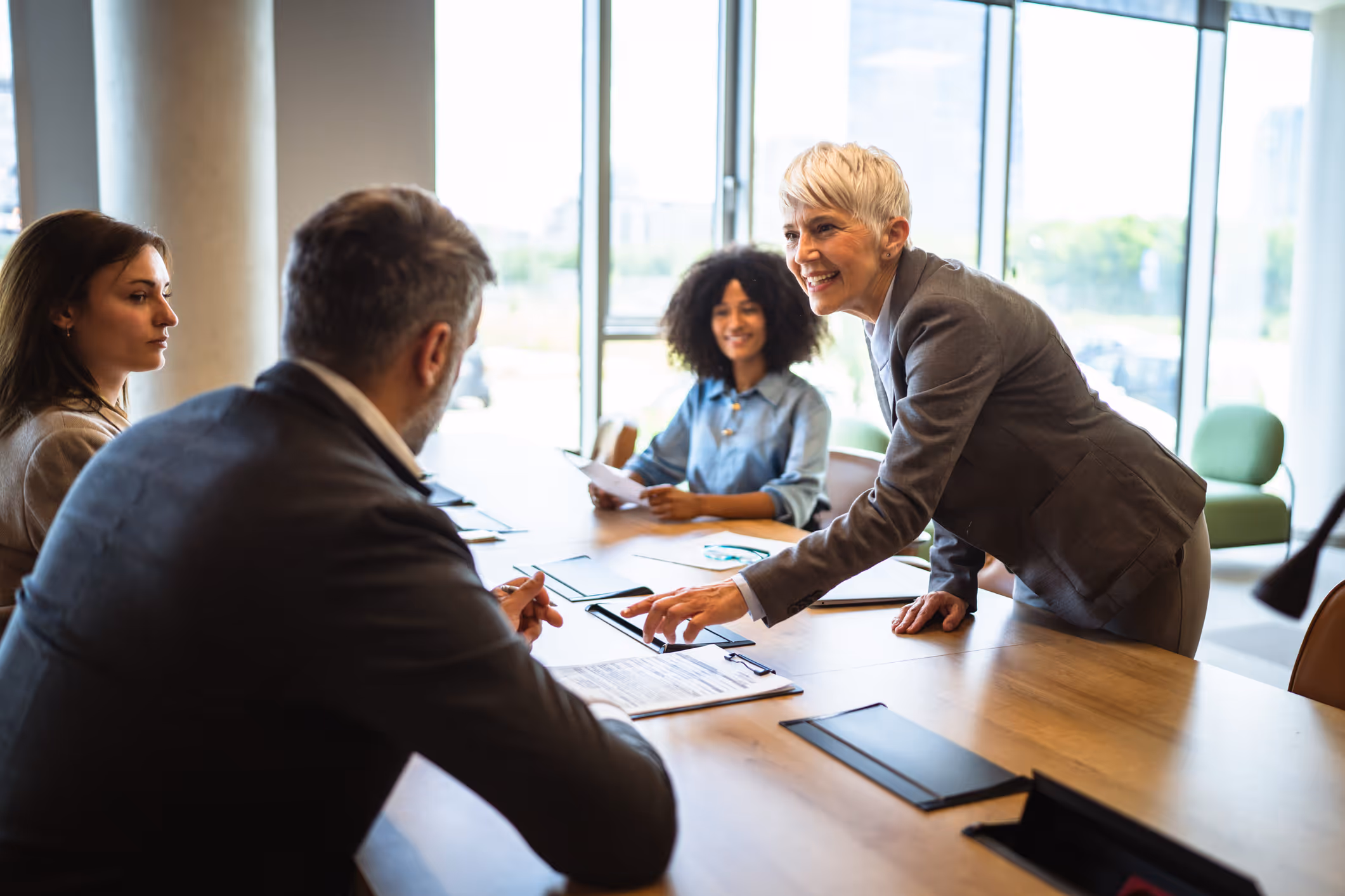 Photo of 2 women in an office laughing