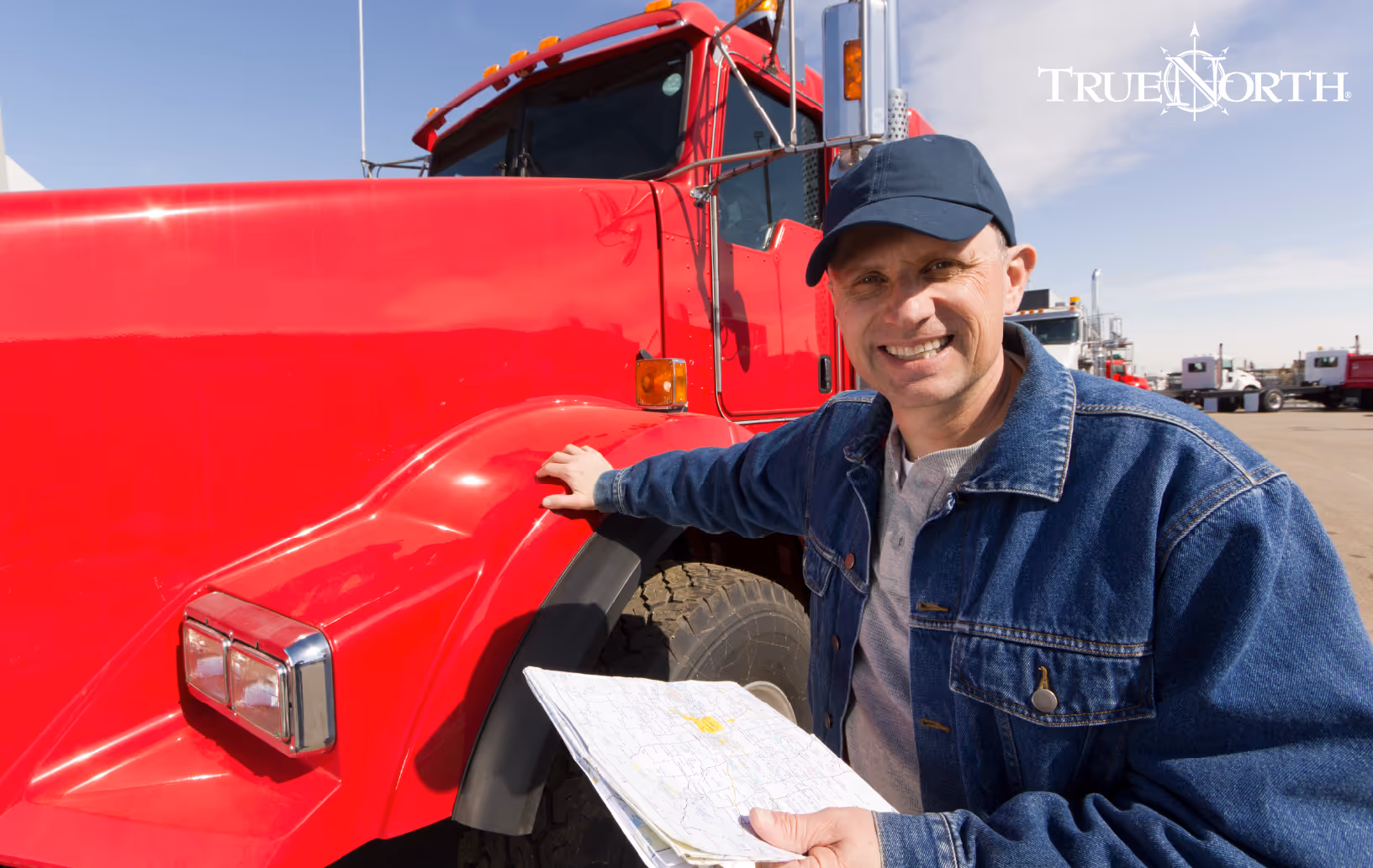 man standing next to semitruck