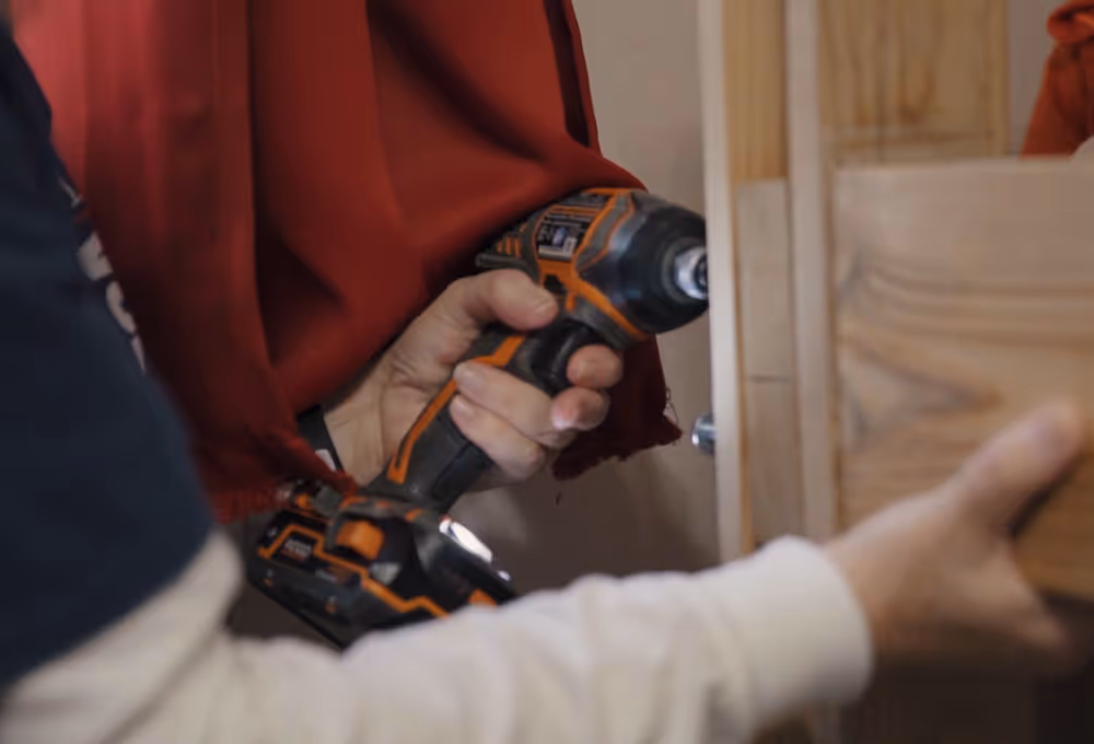 putting a screw into piece of wood
