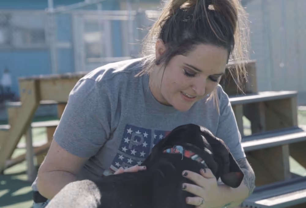 woman holding dog