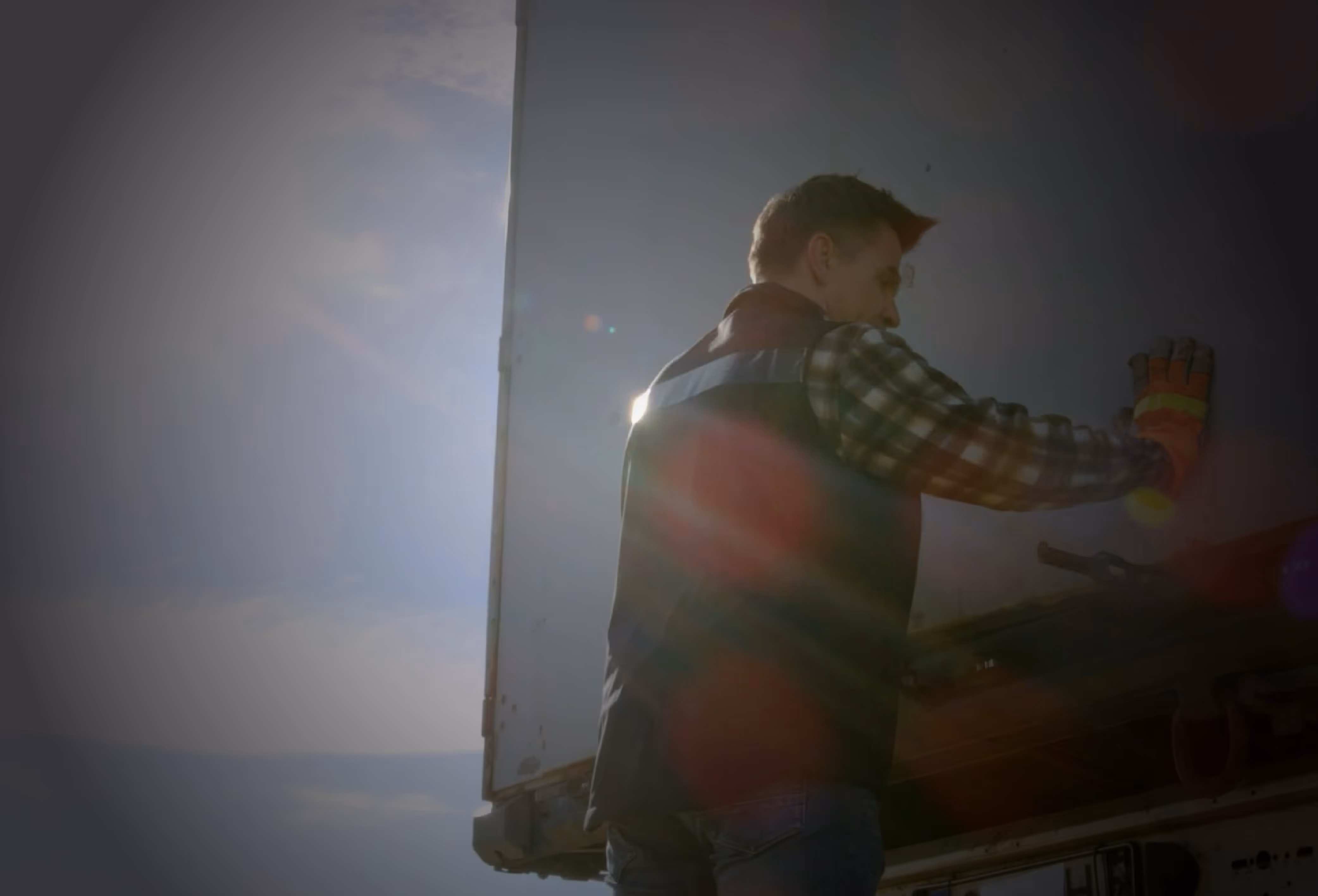driver closing back of a semitruck
