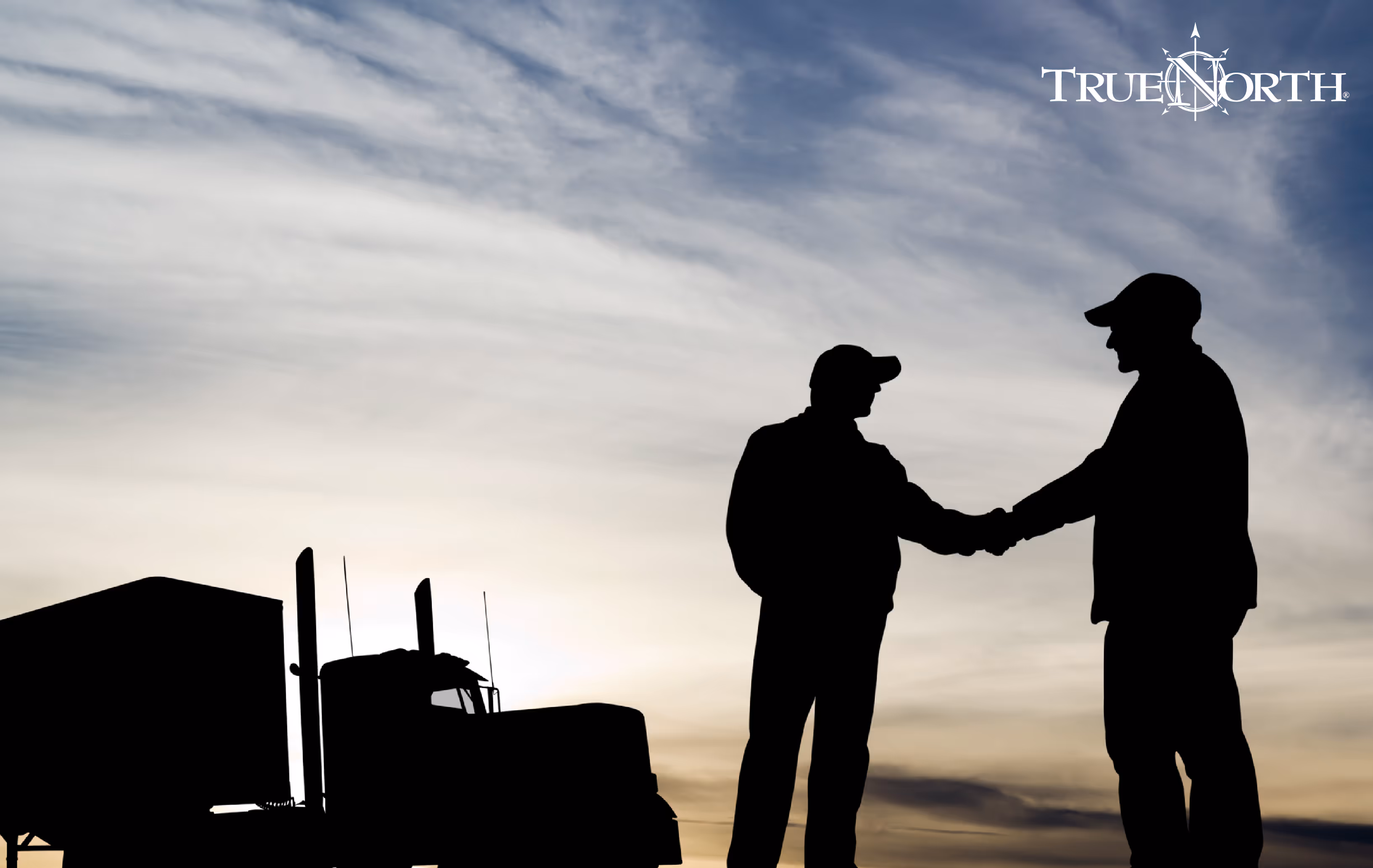 two truck drivers shaking hands