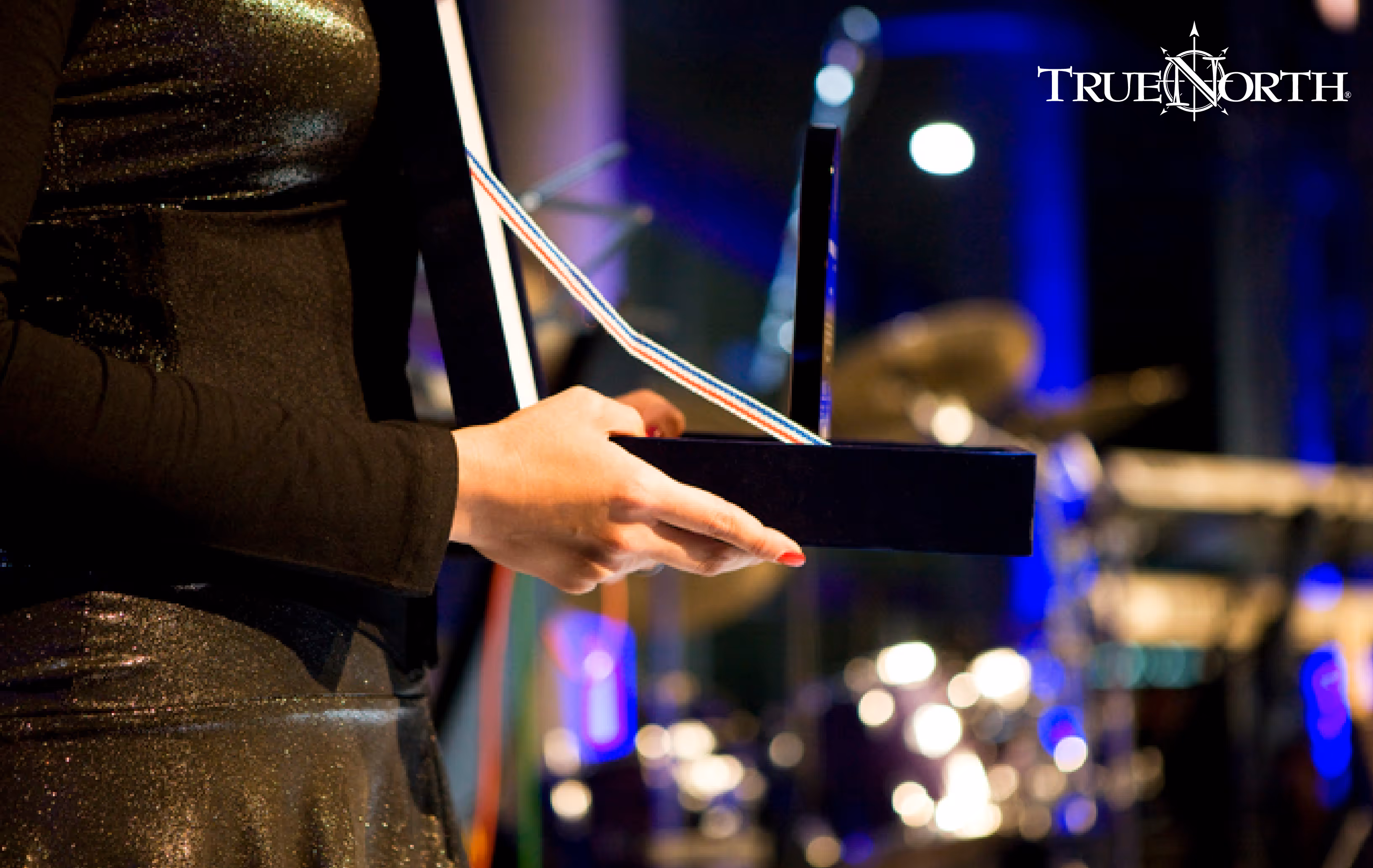 person holding award