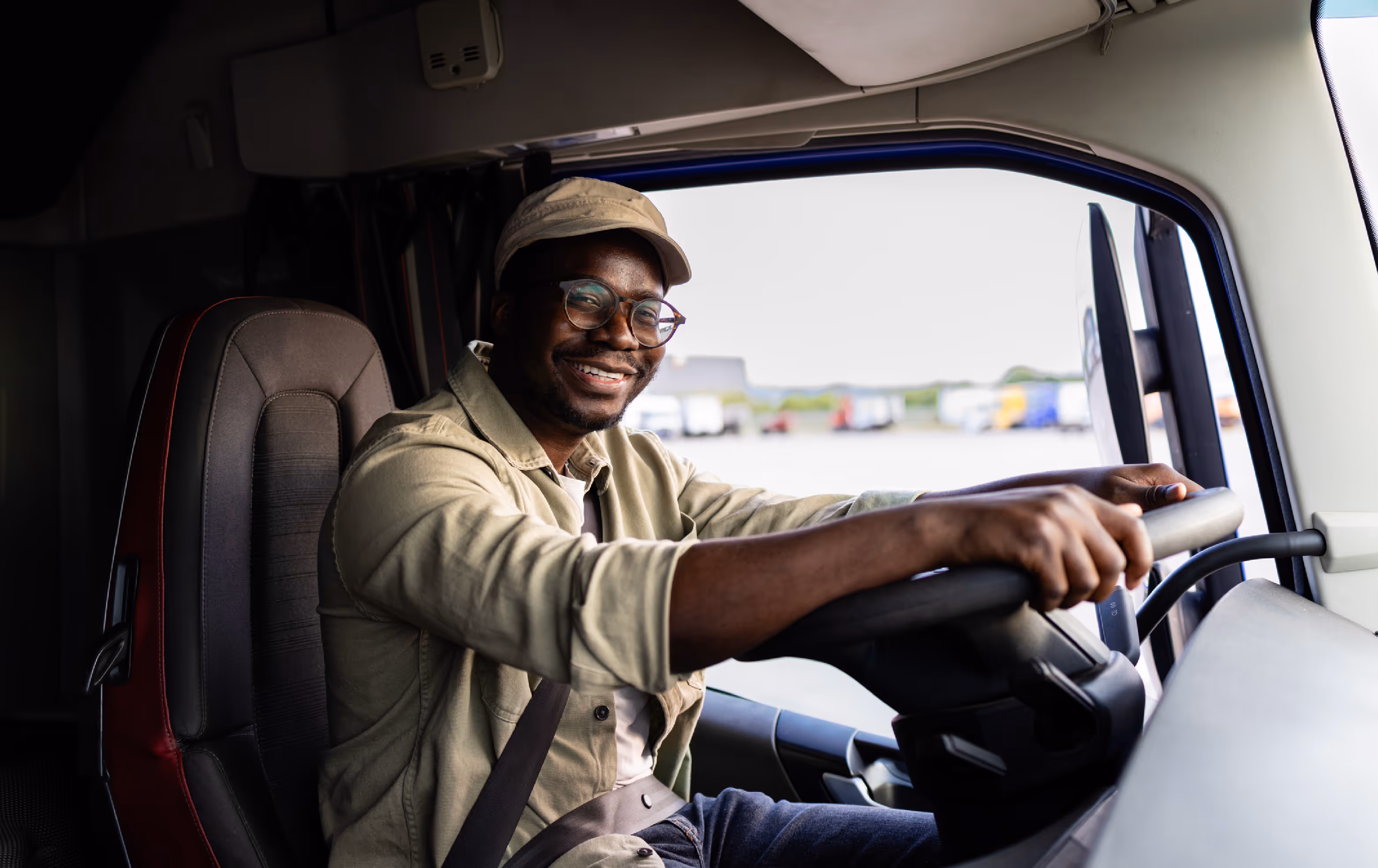 driver in the cab of a truck