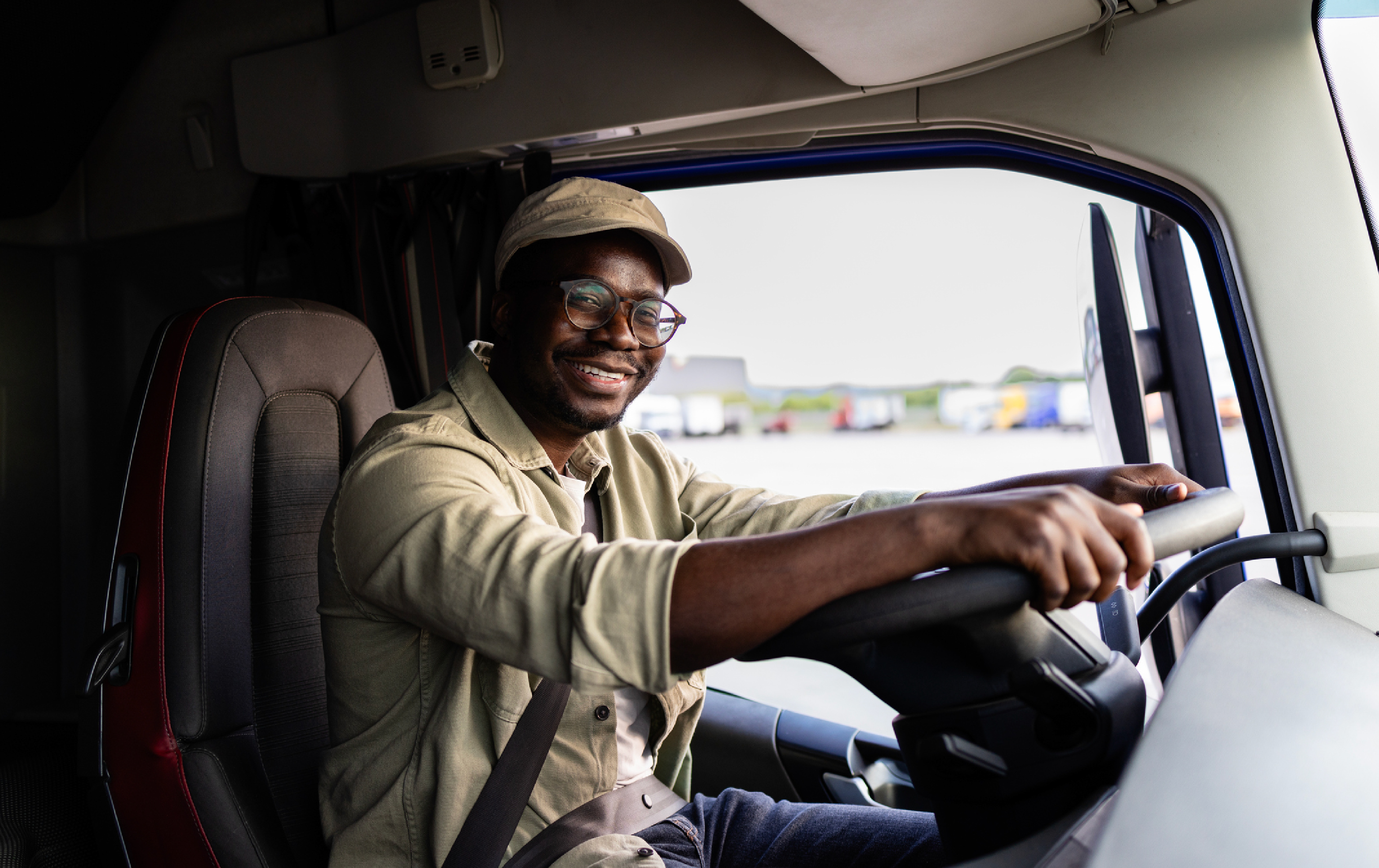 driver in the cab of a truck