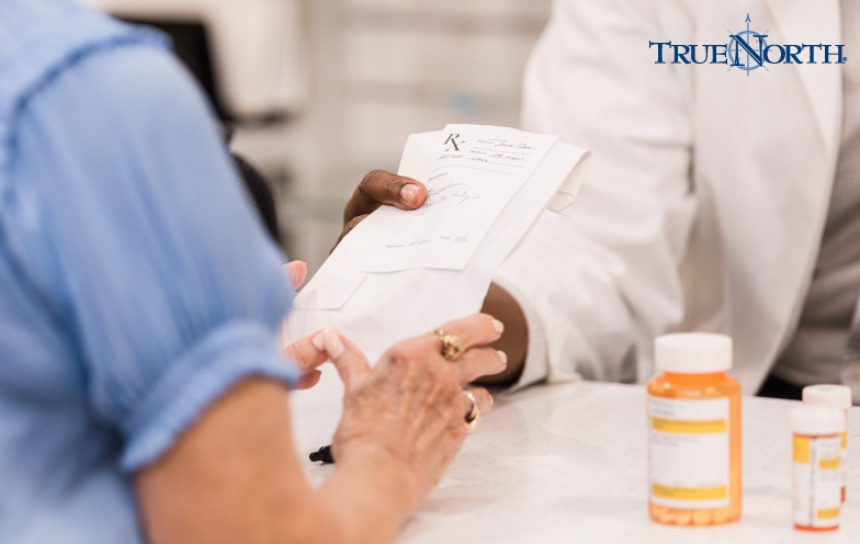 Person at pharmacy interacting with pharmacist