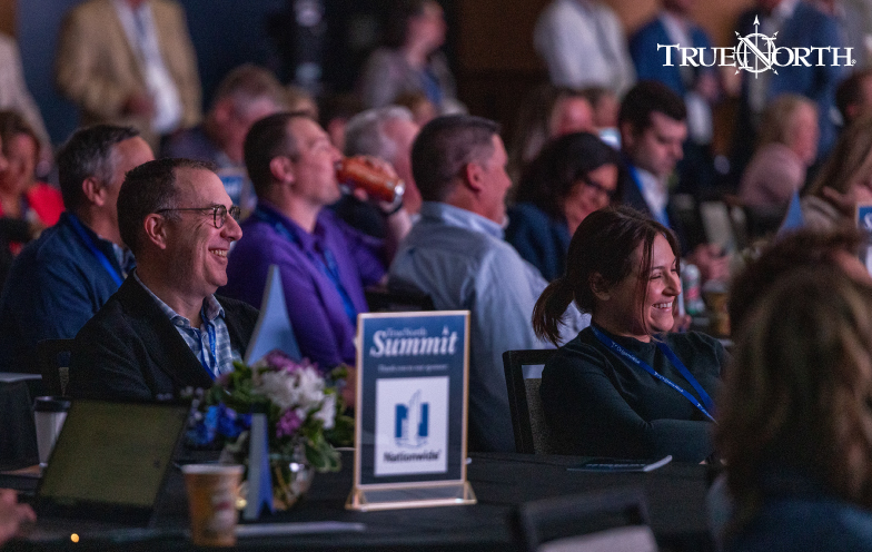 Attendees smile at the TrueNorth Summit