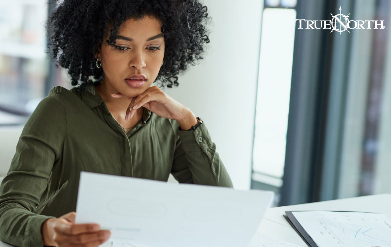Professional woman reviews documents