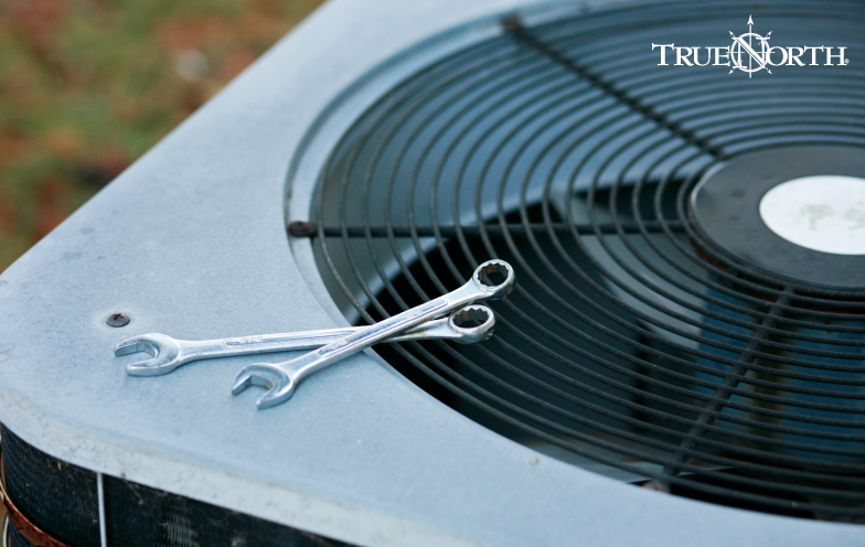 AC unit with wrenches