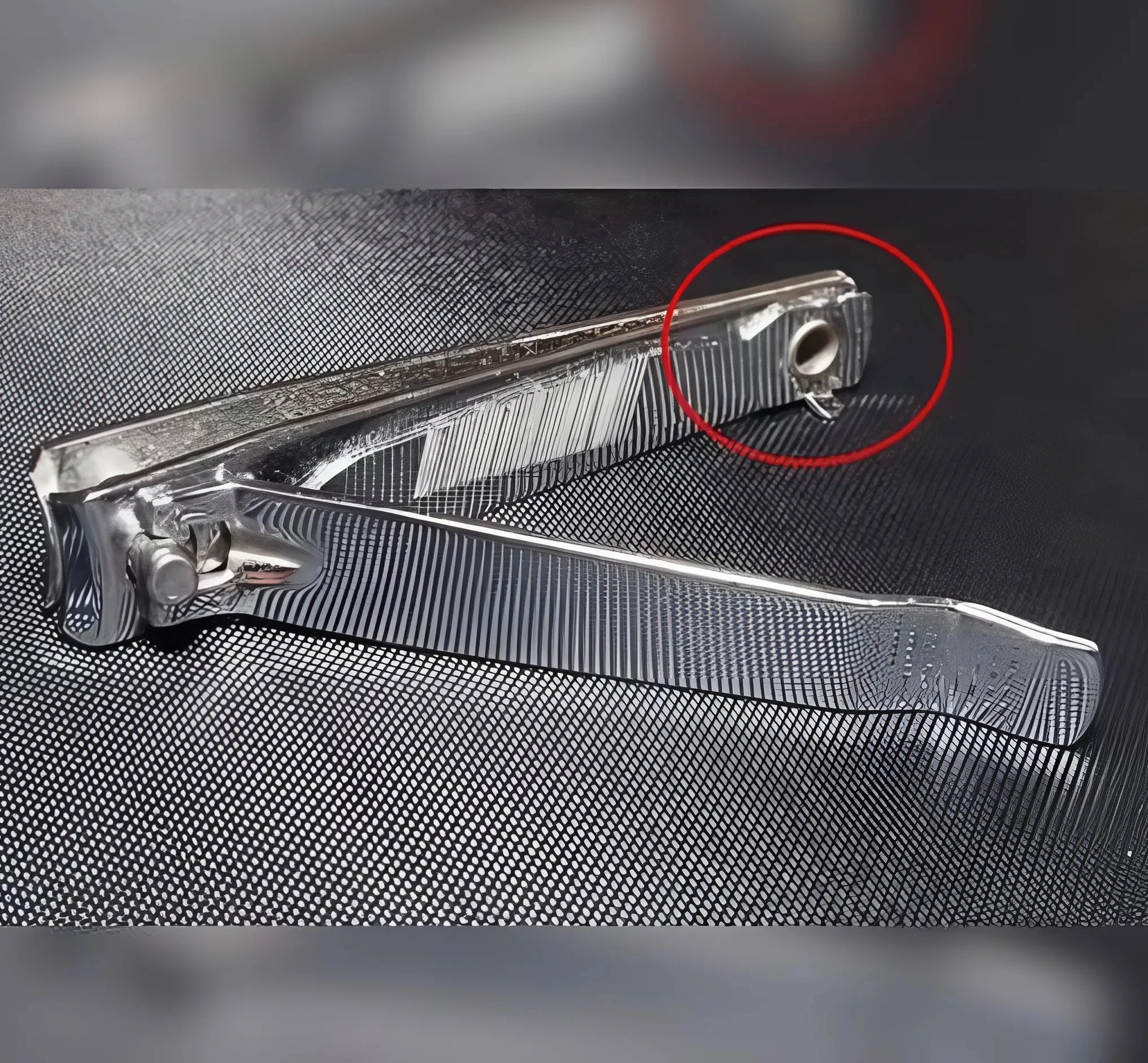 Nail clipper with highlighted hole feature