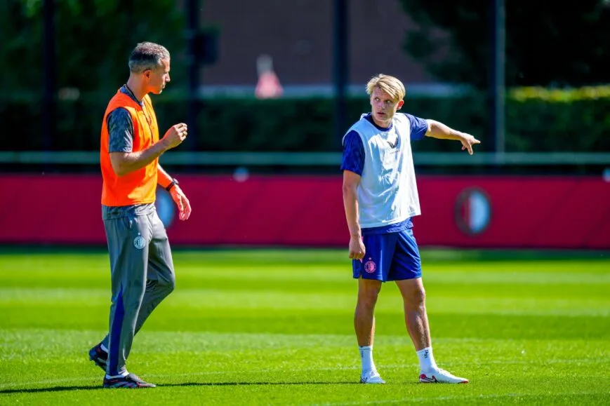 Professional football player training with ball during practice session