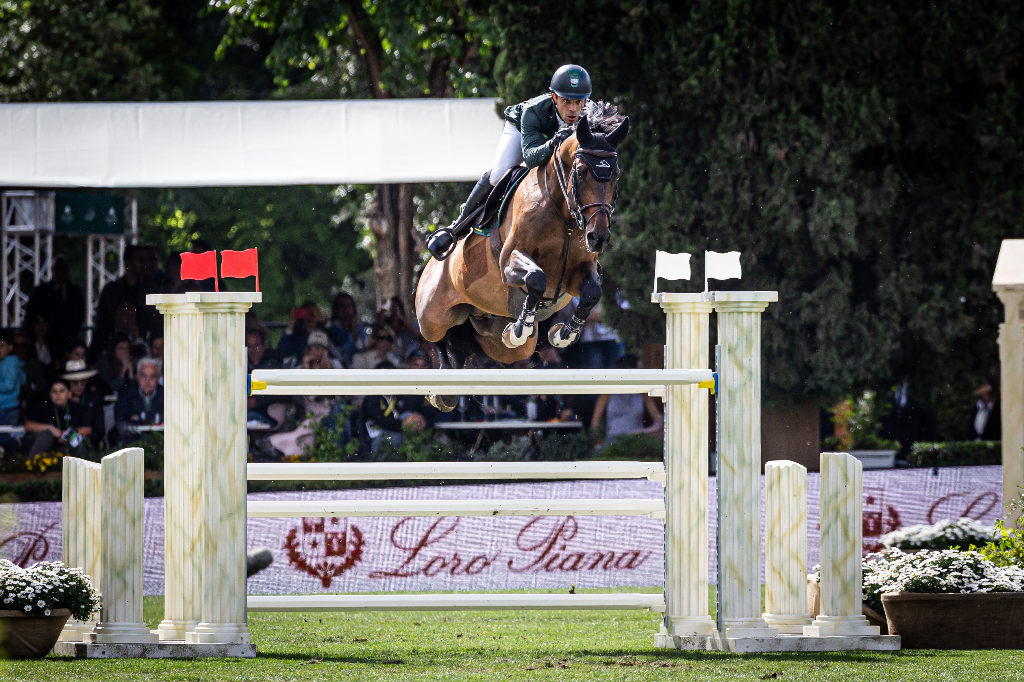 A show jumper clears a high fence during the Loro Piana Grand Prix at CSIO Rome 2025, set in the historic Piazza di Siena arena.