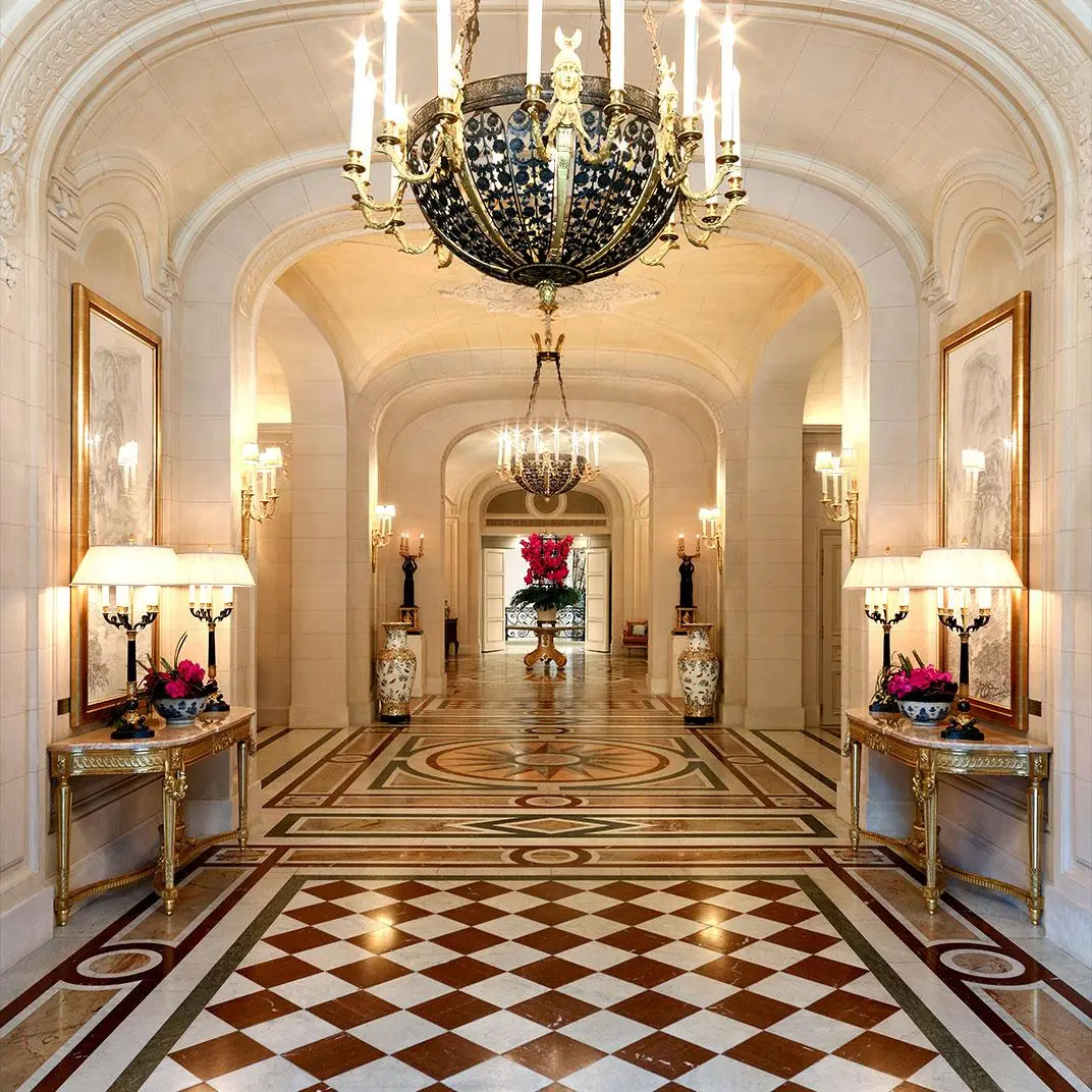 Elegant hallway of the Shangri-La Hotel Paris with grand chandeliers, marble floors, and ornate decor, location for Paris Fashion Show, October 2025.