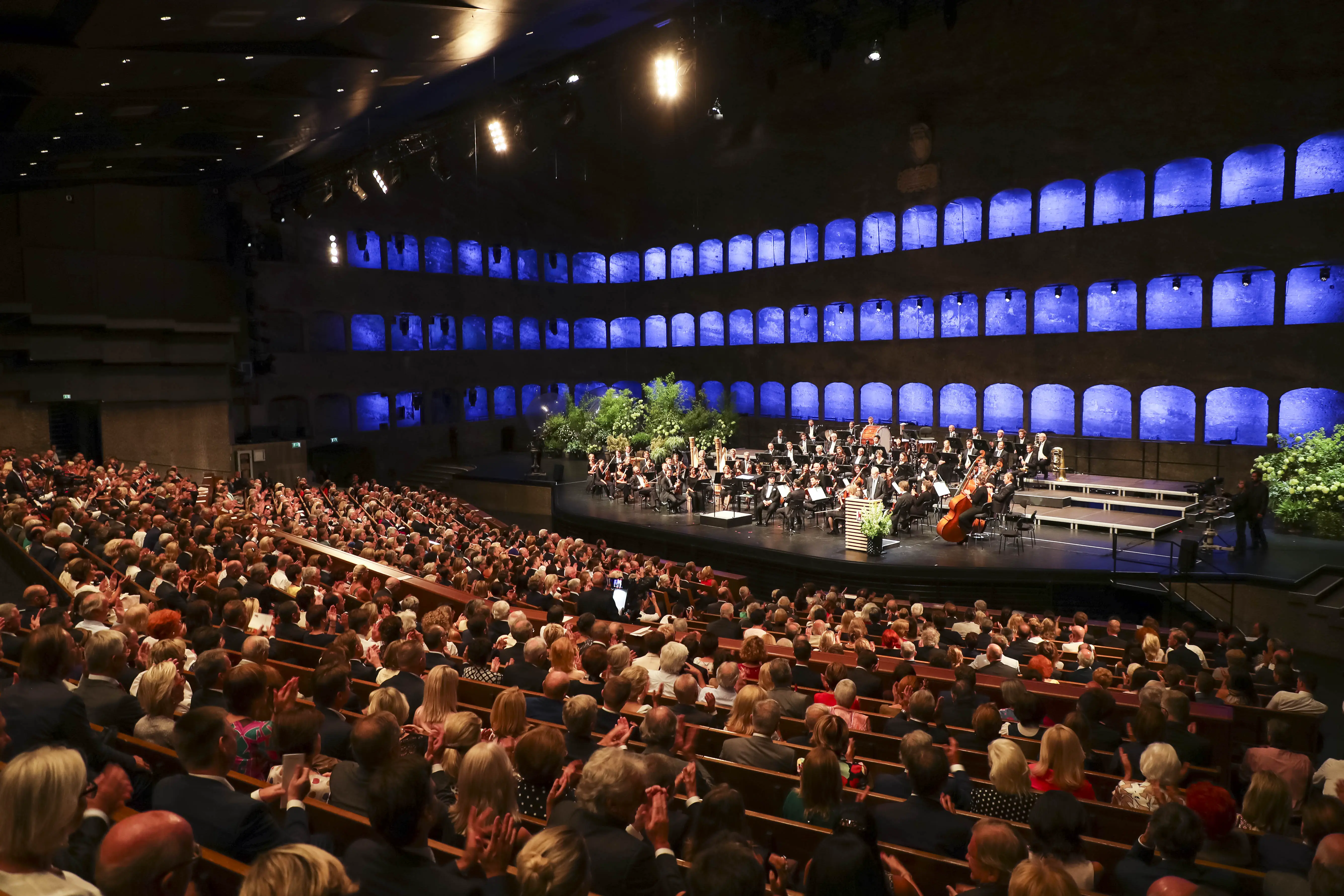 Large audience and orchestra at the Salzburg Festival 2025 opening ceremony in Großes Festspielhaus.
