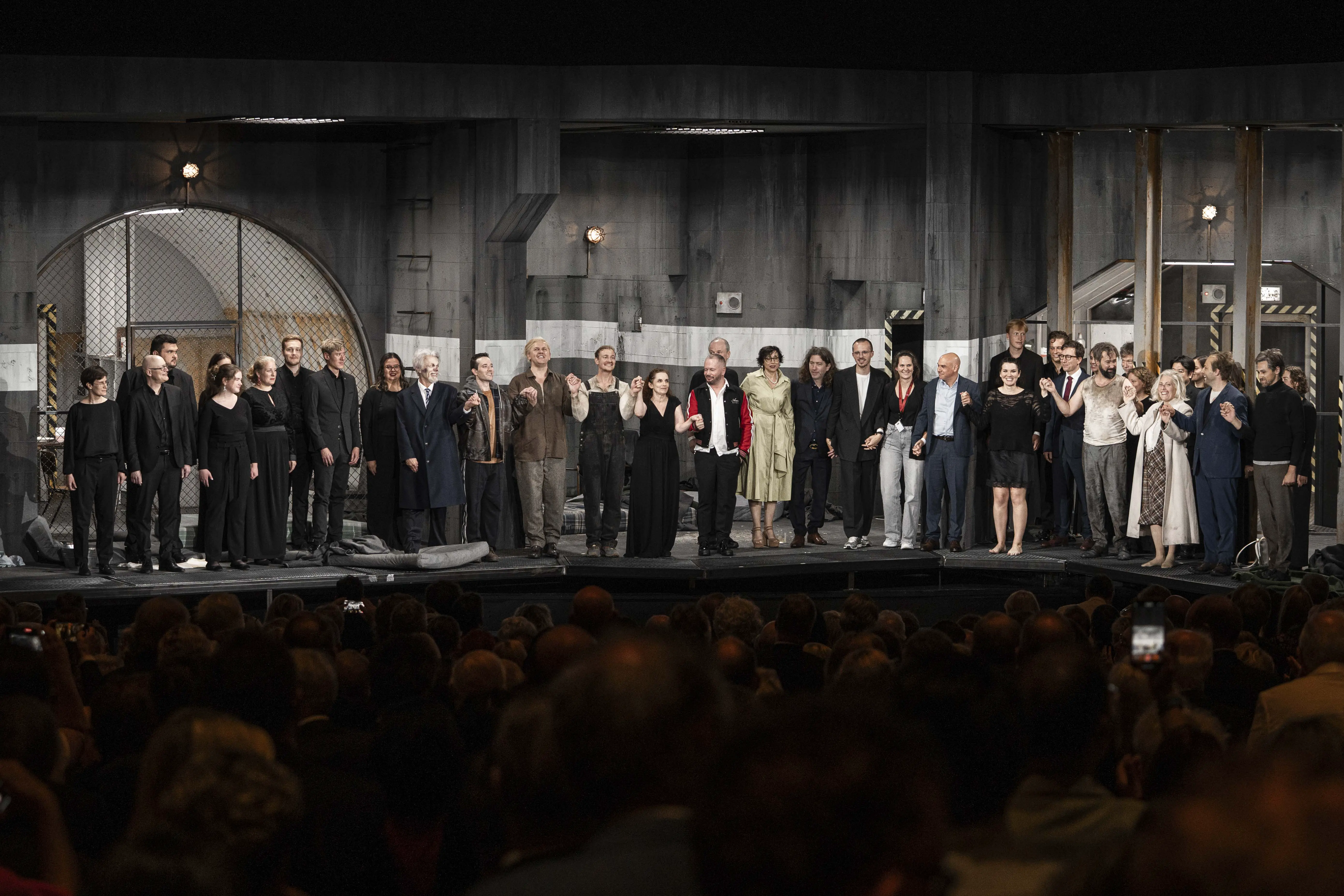 Full cast taking a bow on stage after a theatre performance at Salzburg Festival 2025.