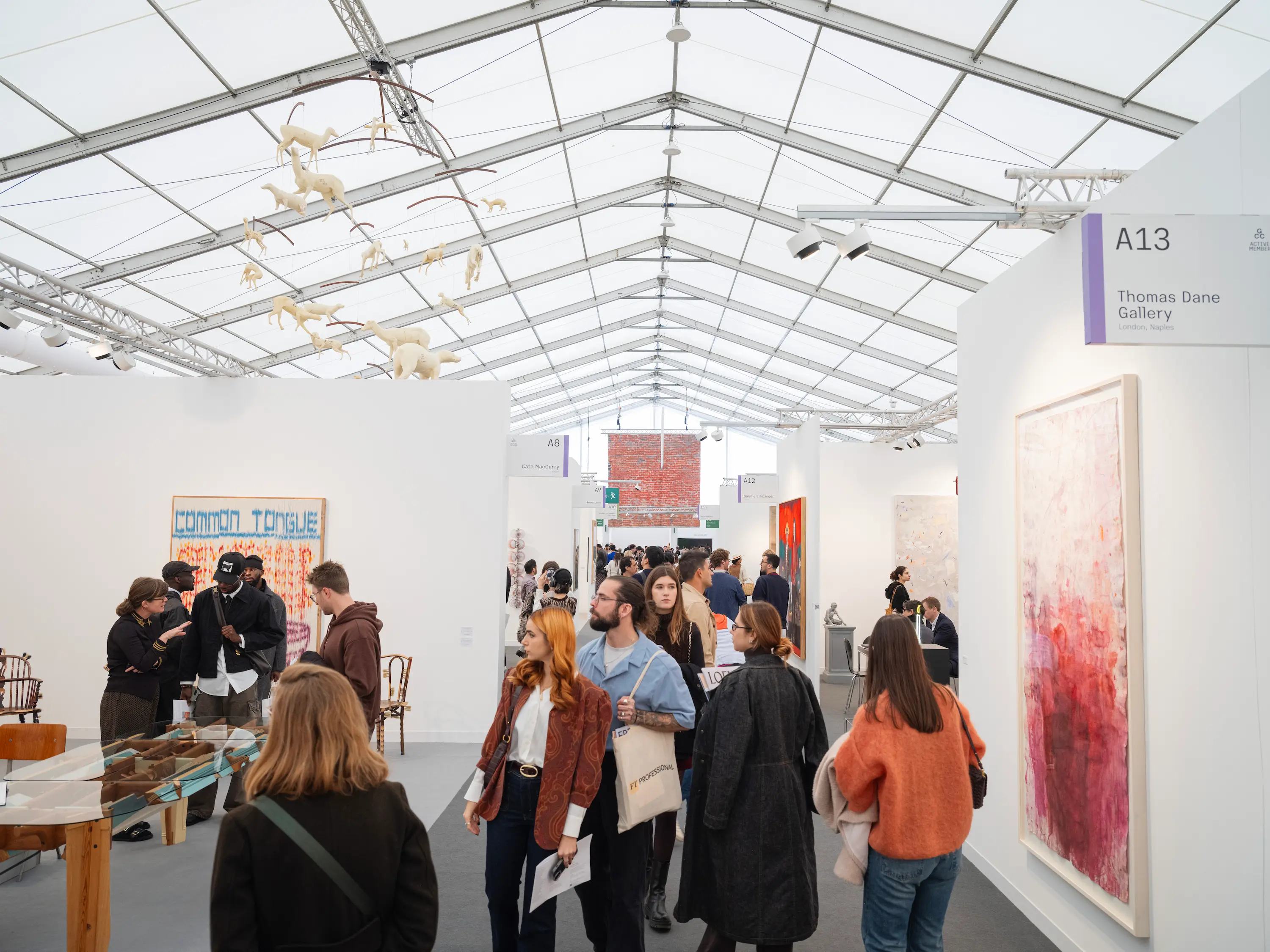 Crowds walking through gallery booths at Frieze London 2025 in Regent’s Park.