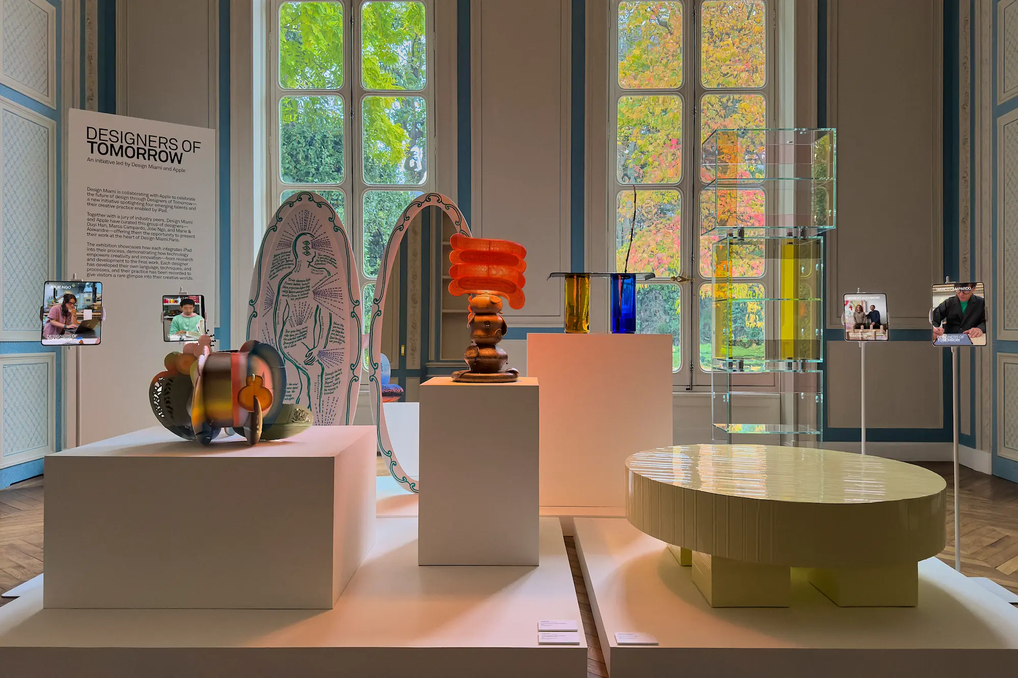 A vibrant exhibition titled “Designers of Tomorrow” at Design Miami.Paris 2025, showcasing colorful contemporary furniture and sculptural designs by emerging talents, presented in collaboration with Apple inside the Hôtel de Maisons.