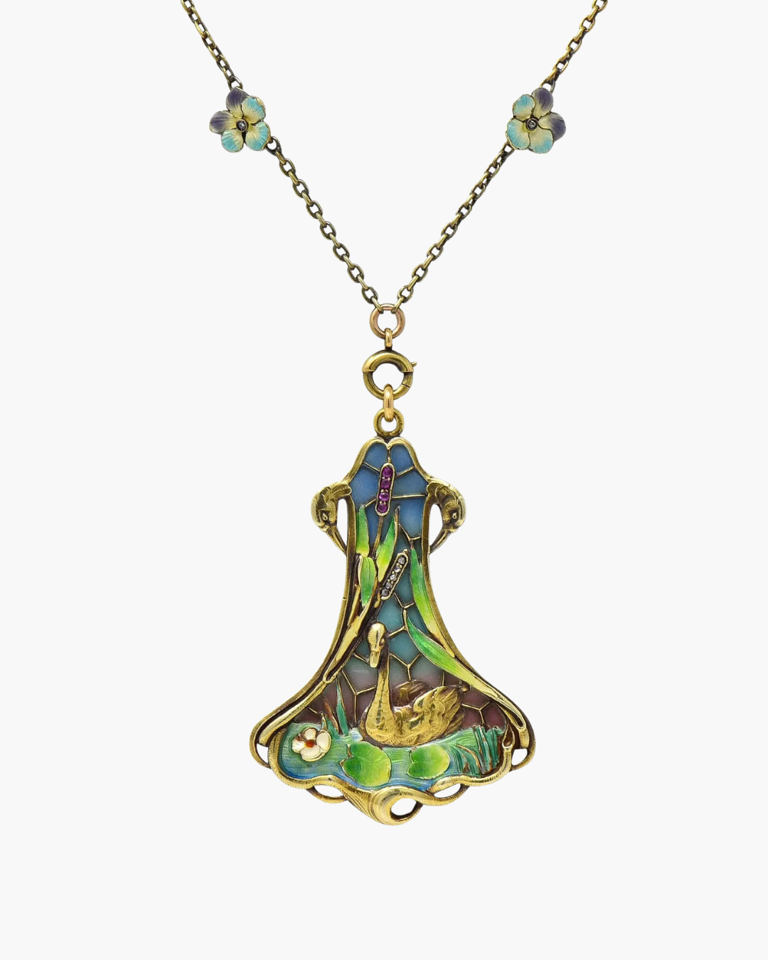 Art Nouveau pendant depicting a swan on a lily pond, crafted in 14k gold with plique-à-jour enamel in blue, green, and pink hues, accented by rose-cut diamonds and rubies on a delicate floral chain.