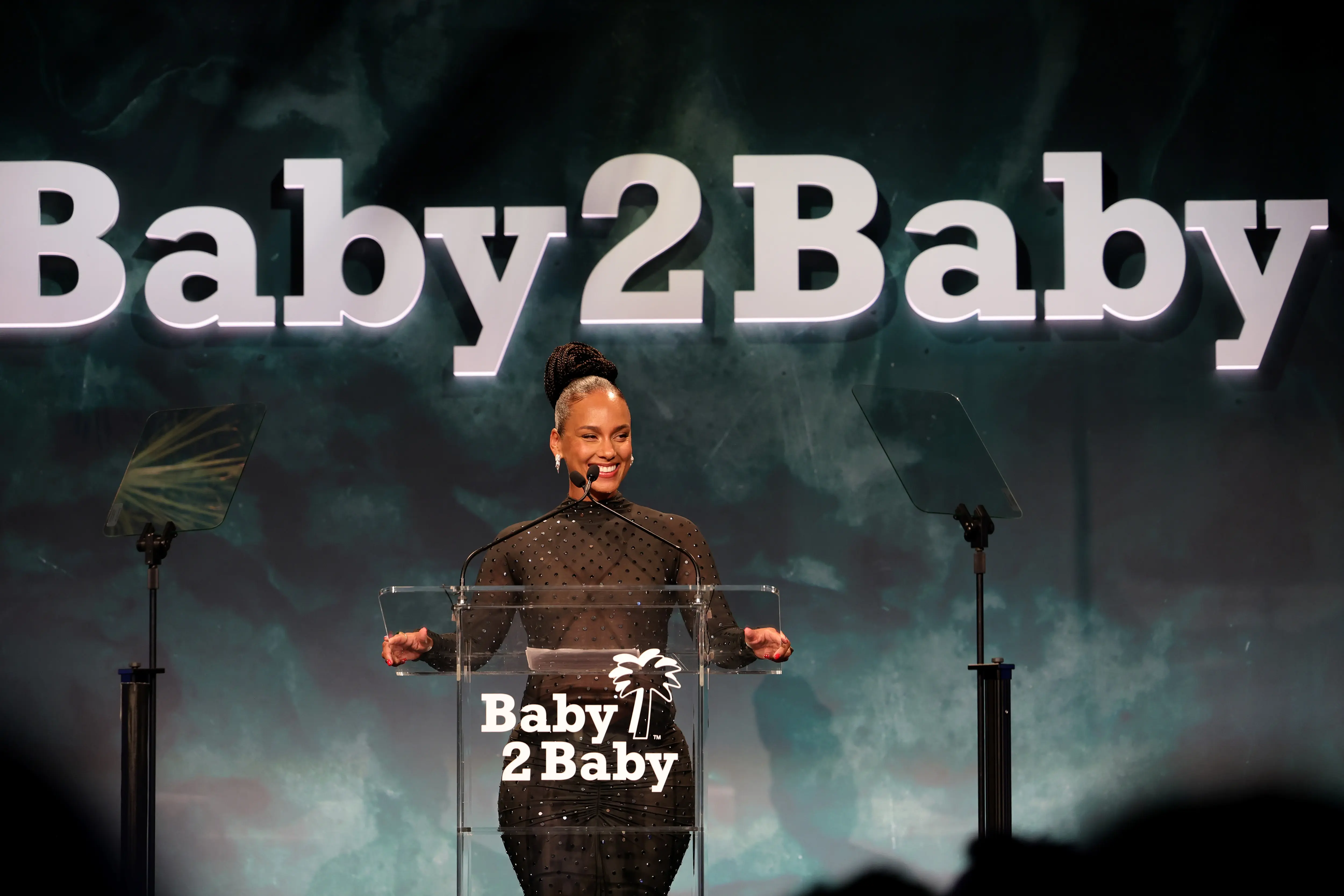 Alicia Keys delivers a heartfelt speech on stage at the 2025 Baby2Baby Gala in Los Angeles, celebrating philanthropy and empowerment during the star-studded charity event.