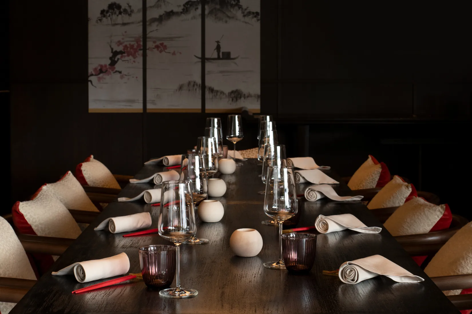Byakko Japanese restaurant at Six Senses Crans-Montana featuring elegant table setting with crystal glassware, contemporary ceramics, and traditional Japanese ink painting artwork