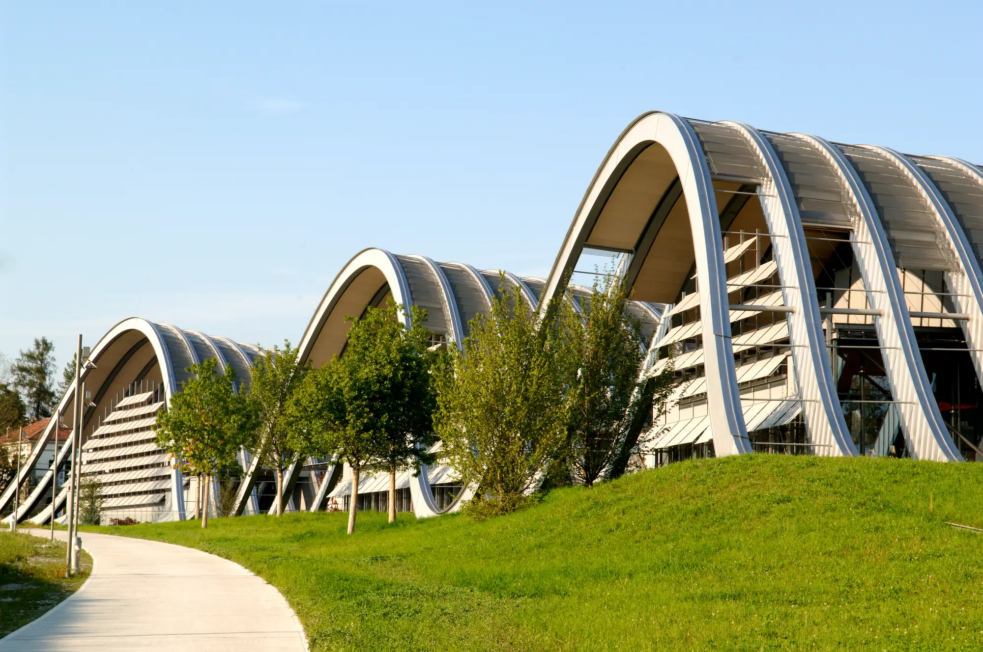 Renzo Piano's three undulating steel and glass waves of Zentrum Paul Klee museum integrated into Bernese landscape