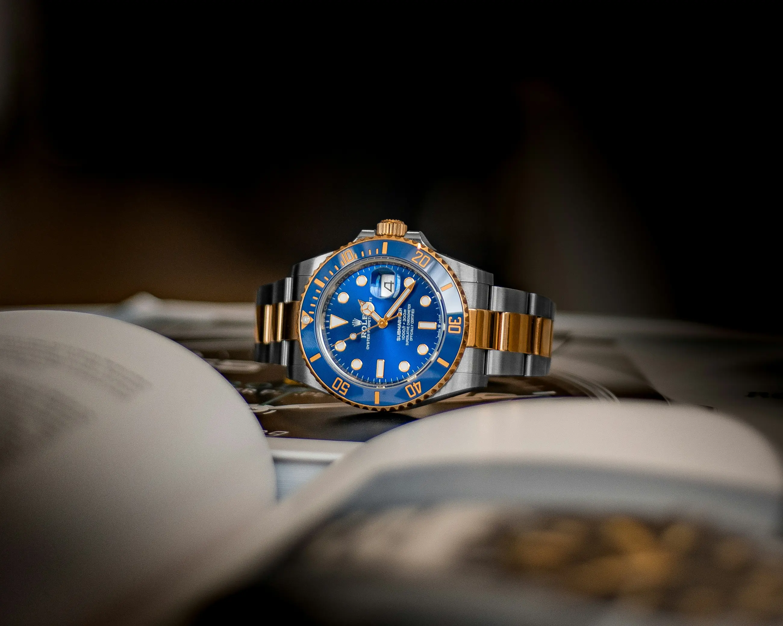 Rolex Submariner blue dial two-tone steel and gold luxury dive watch on elegant surface Swiss horology