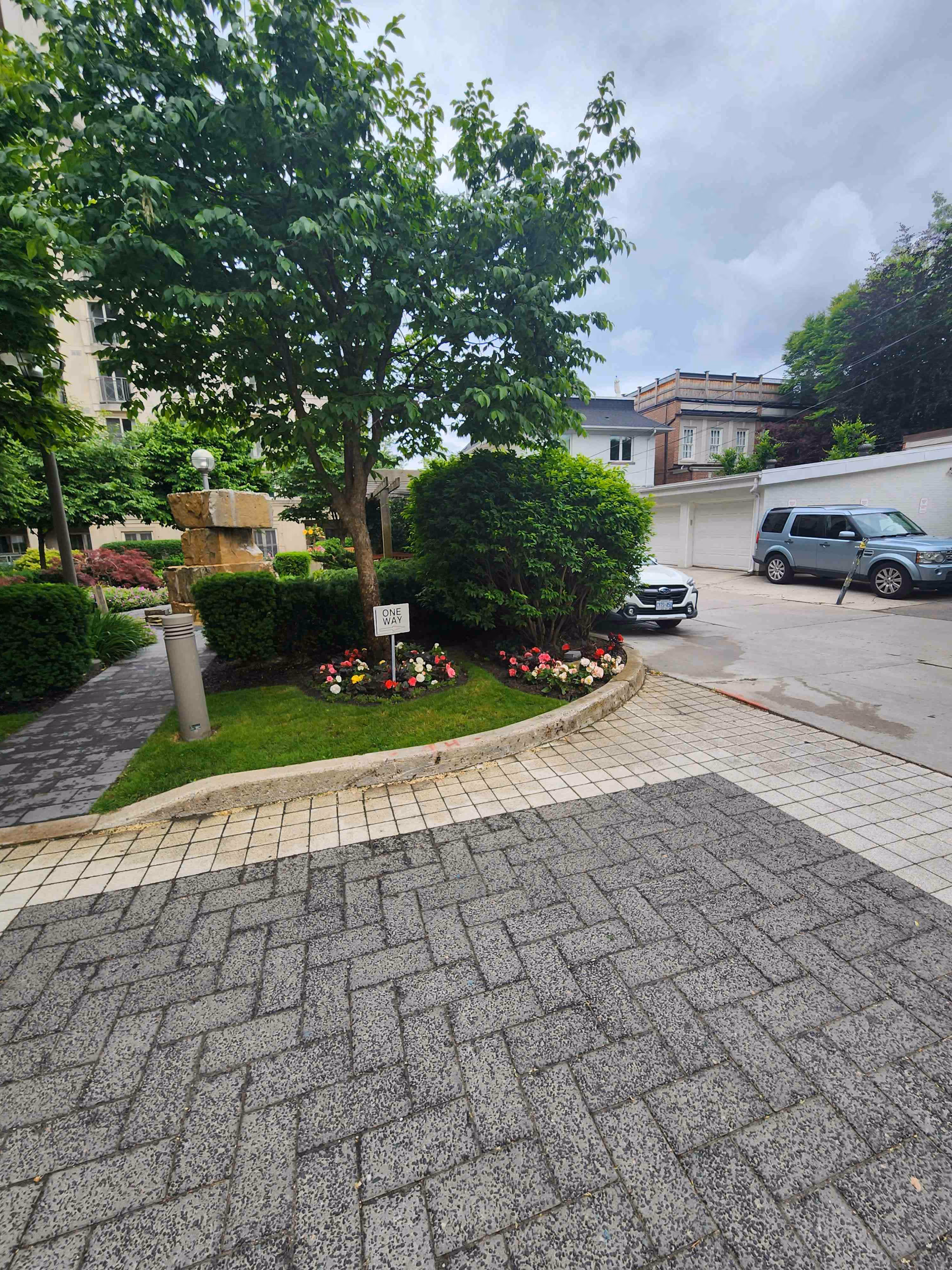 Curbside View of back entranceway to the property. Different plants when maintained well give a green spark to the property.