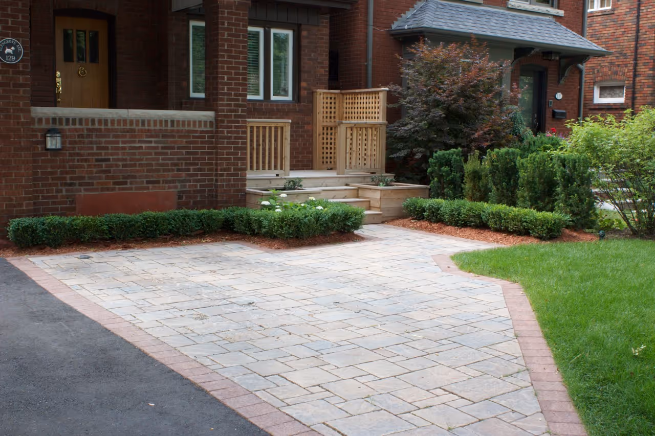 Front entrance with interlock stonework leading up to home entryway