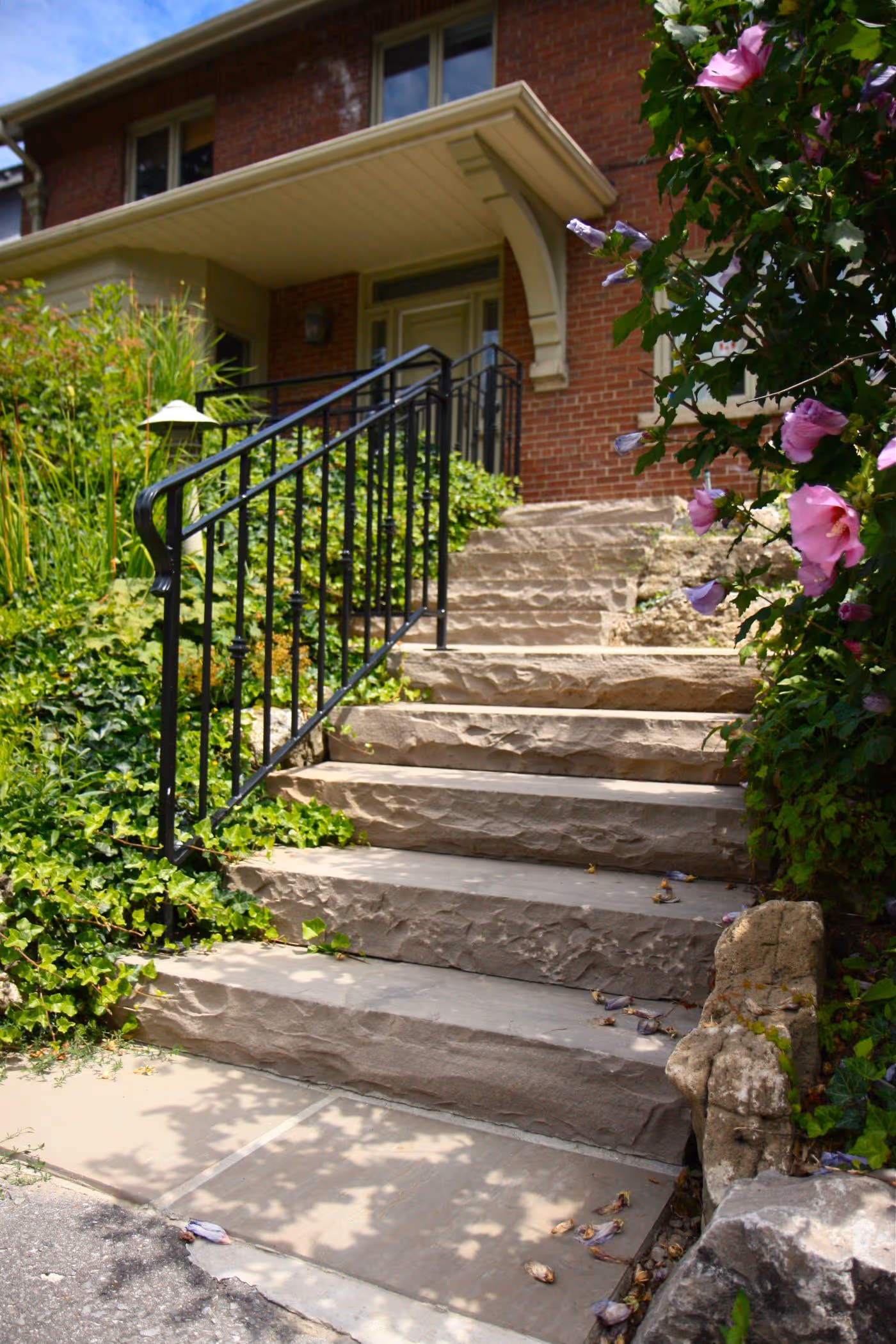 stone stair case side angle showcasing garden beds