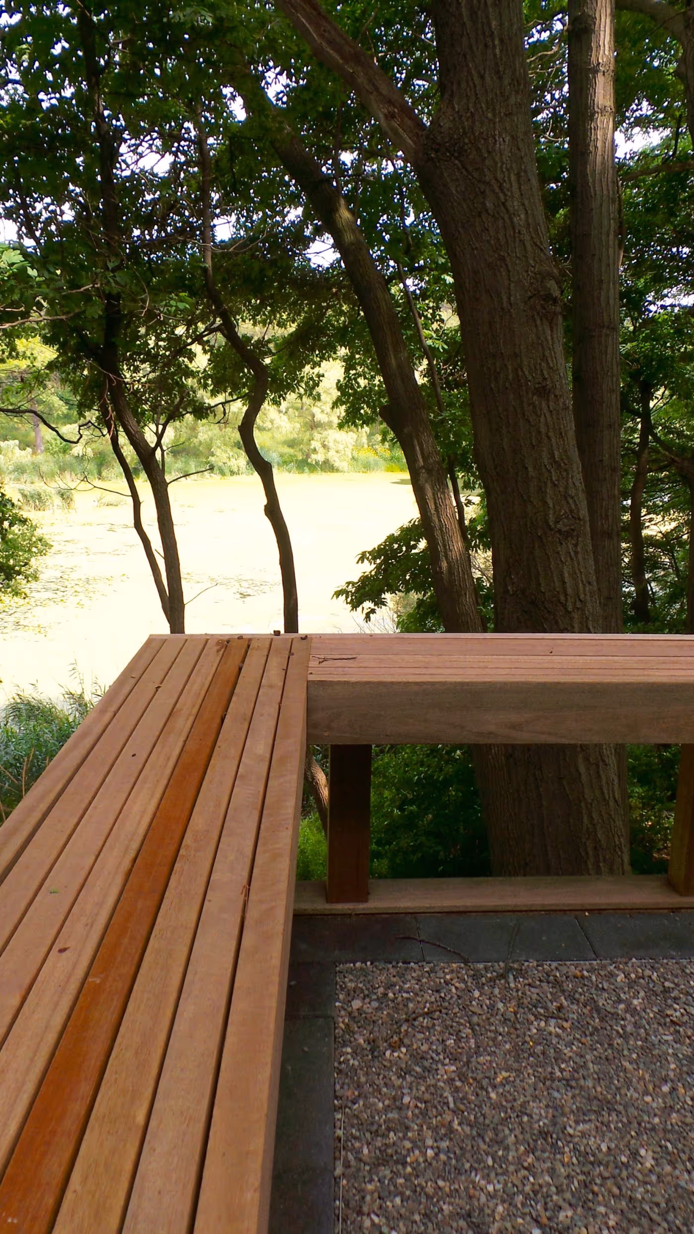 Wood seating and railing on stone lined deck